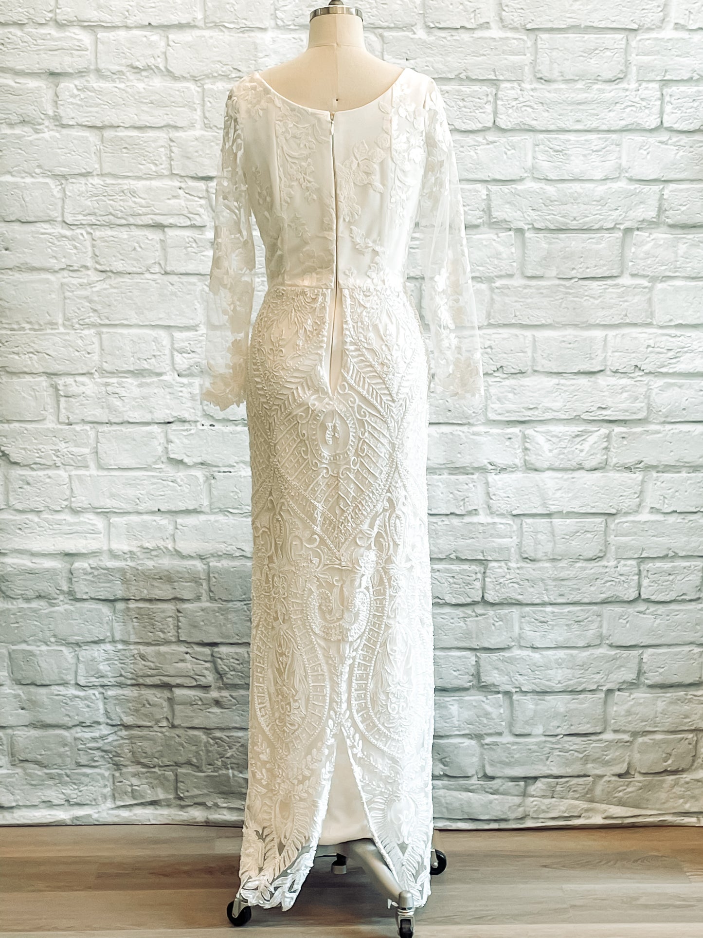 Back view of Octavia wedding dress showcasing high scoop neckline and floral lace detail