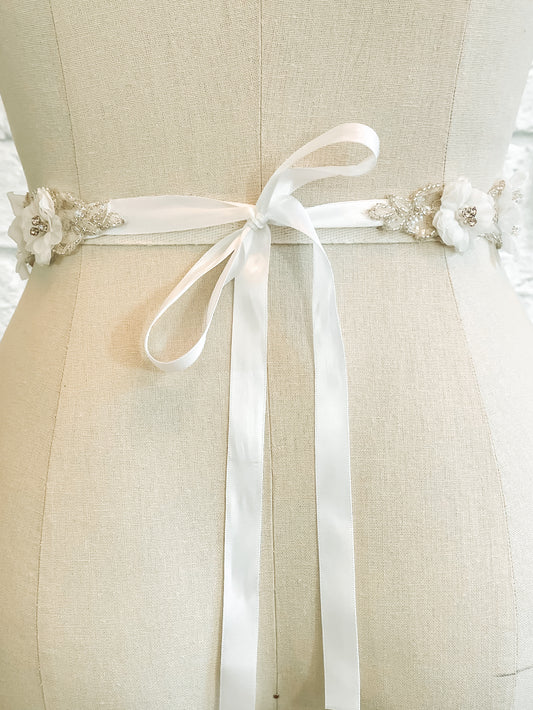Back view of the Heidi bridal belt on a mannequin; the is belt tied in a bow with soft ribbon tails.