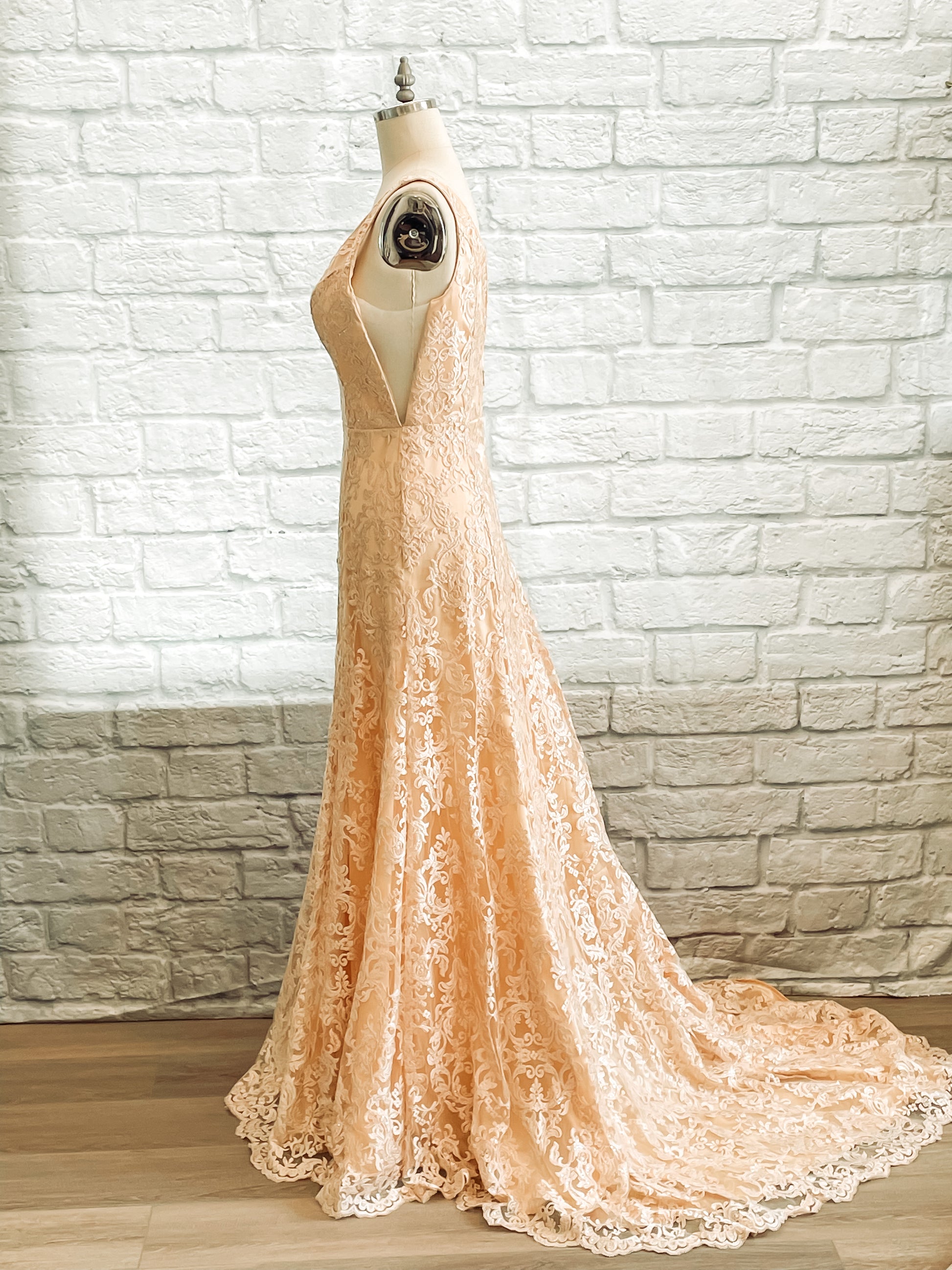 A full side view of the Margaret gown with a Lace overlay, illusion cutout on satin trumpet gown.