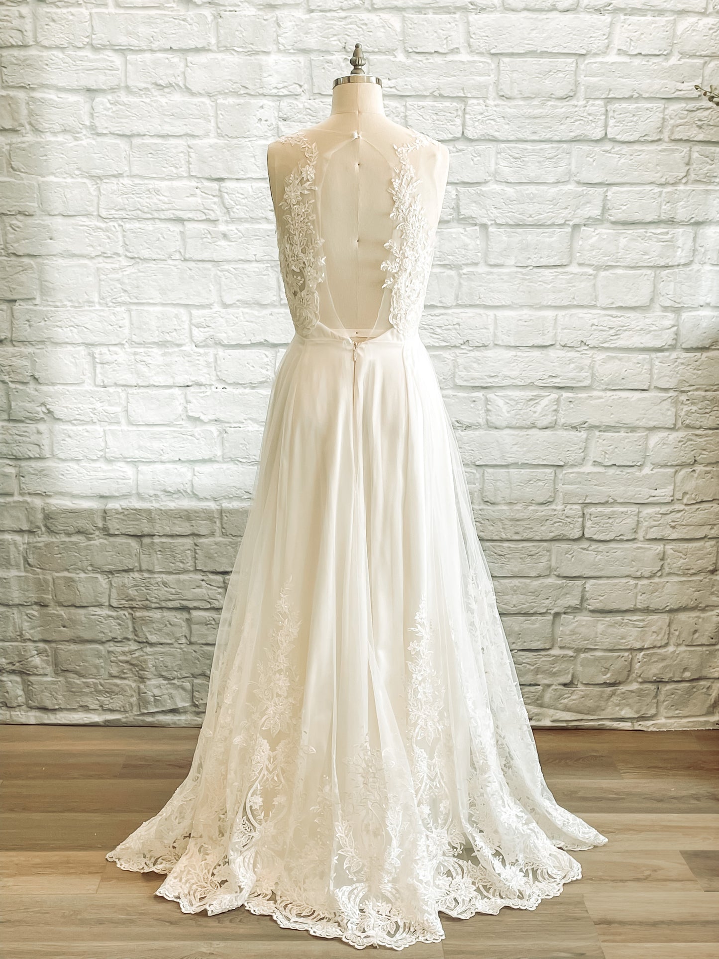 Full back Marie bridal gown with a Keyhole back with lace overlay and scalloped hem.