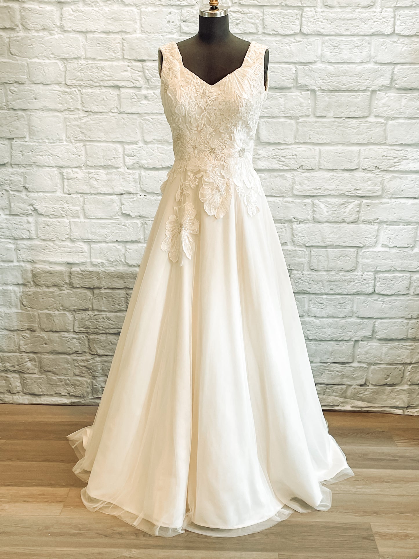 Full front of the Poppy gown with square-sweetheart neckline, tulle skirt,  and floral lace bodice