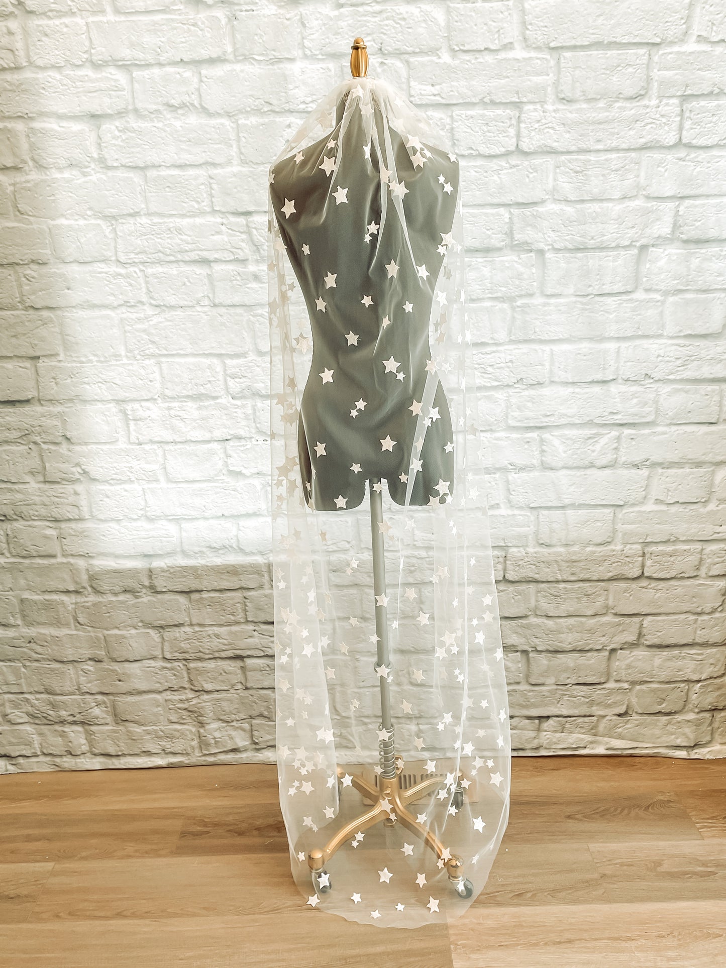 Dramatic back view of mannequin with celestial Nova veil flowing over the shoulders