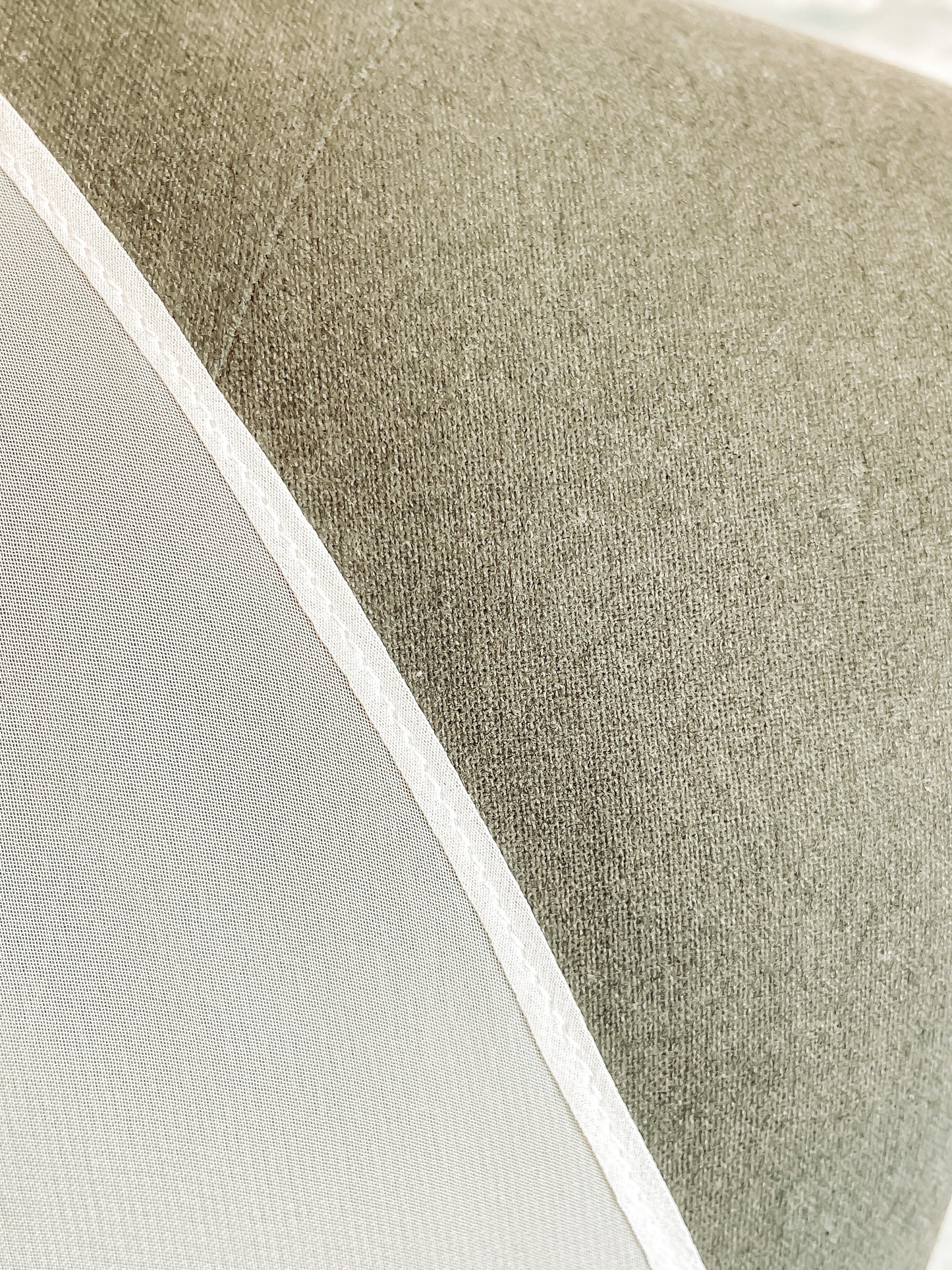 A close up of the rolled finished edge of the Chiffon bridal veil, Braelyn.