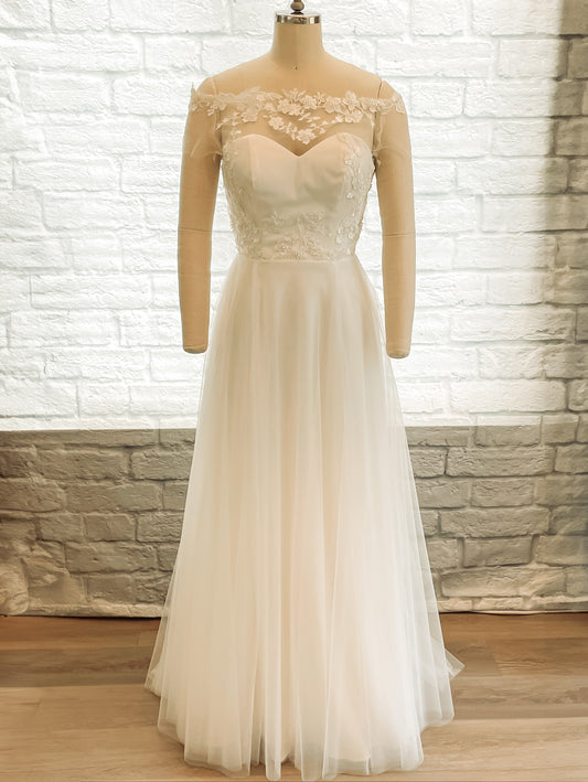 Full-length front view of the Constance gown on a mannequin, showing the layered tulle skirt and floral lace illusion bodice with sweetheart neckline.