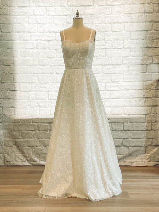 Full front view of Emerson bridal gown on a mannequin, showing glitter tulle and A-line silhouette.
