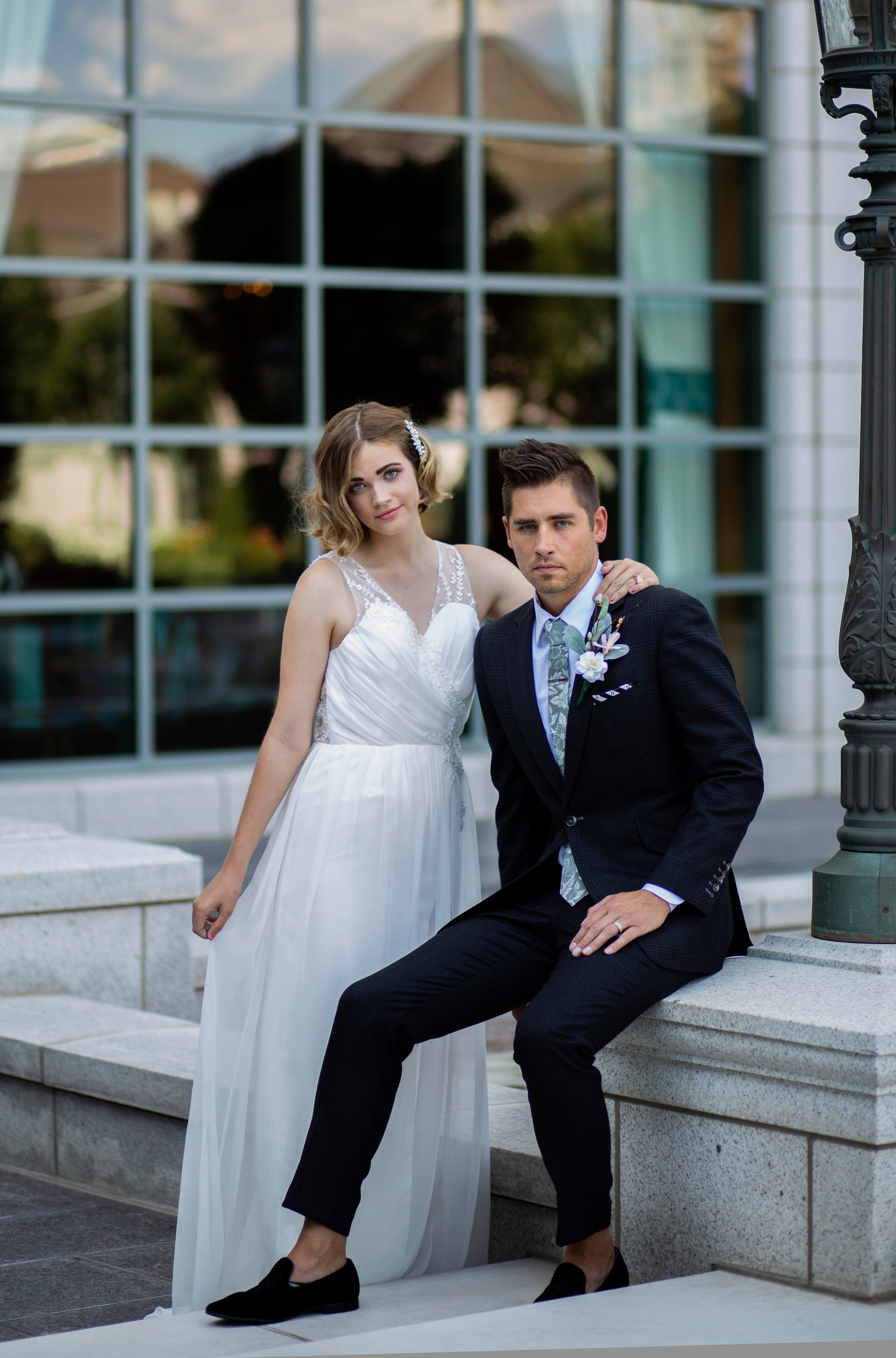 Bride and groom with bride wearing the gathered and drapped chiffon odette bridal gown