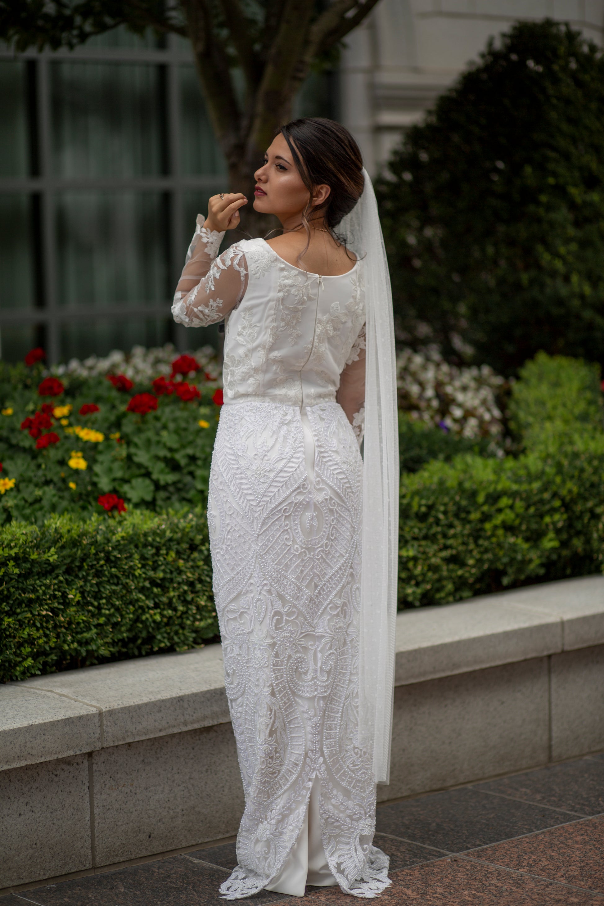 Bride wearing Octavia gown with beaded skirt and lace bodice