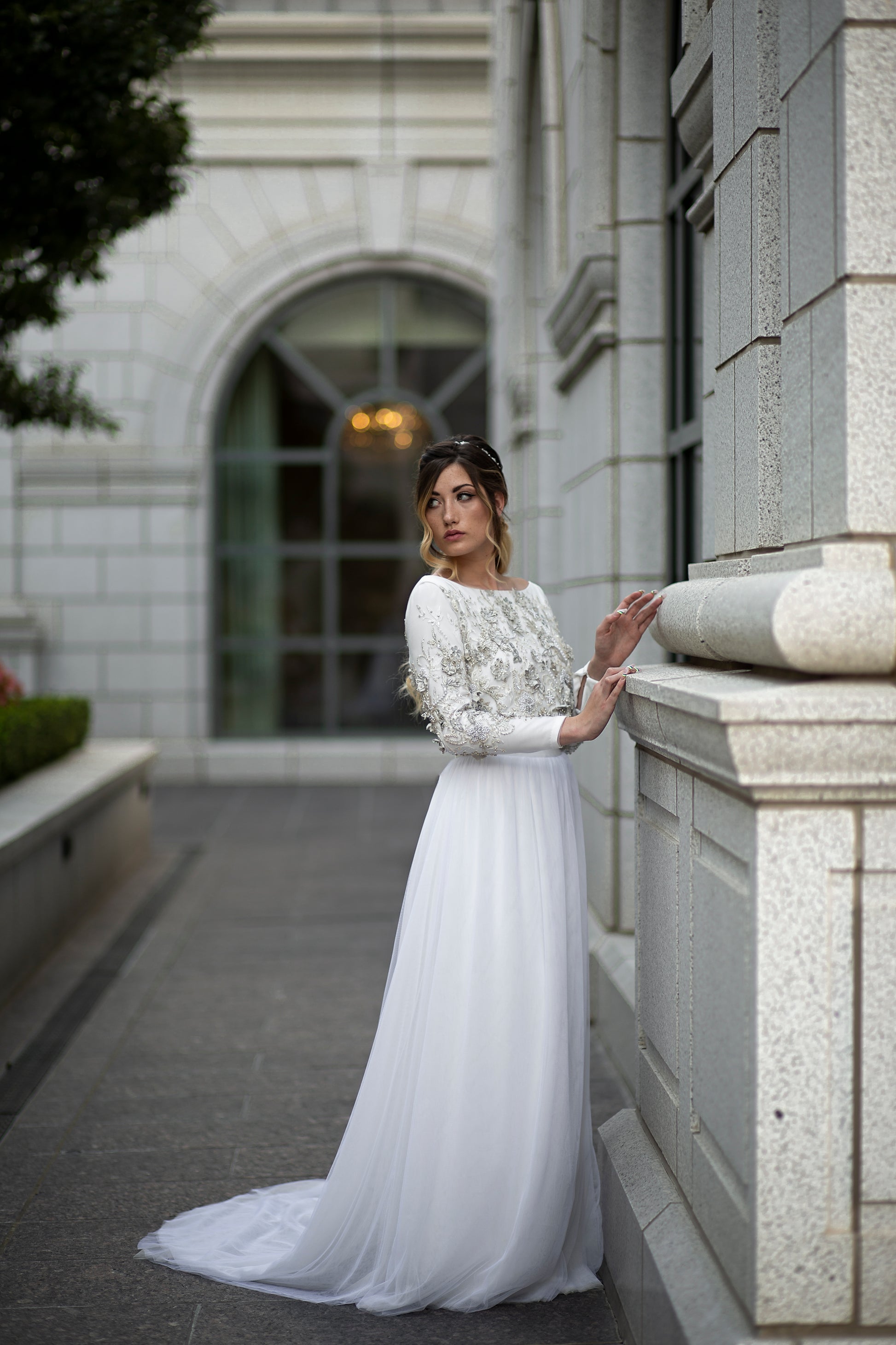 Full front ¾ view of Ember on model, showing off the 3D floral lace bodice and soft layered tulle skirt.