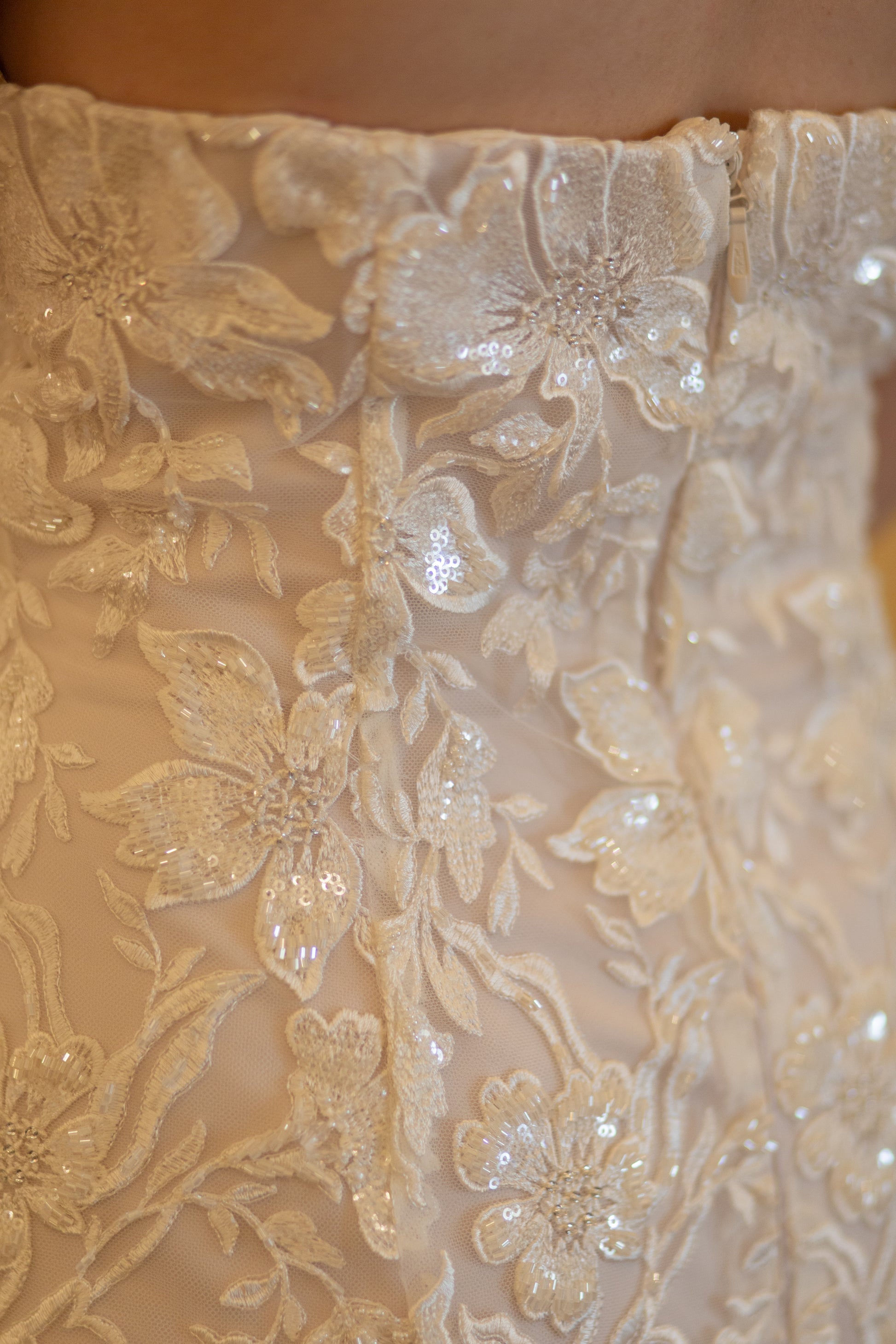 A close up of the lace and beadwork on the Sawyer gown; Variety of beadwork and lace embroidery up close.