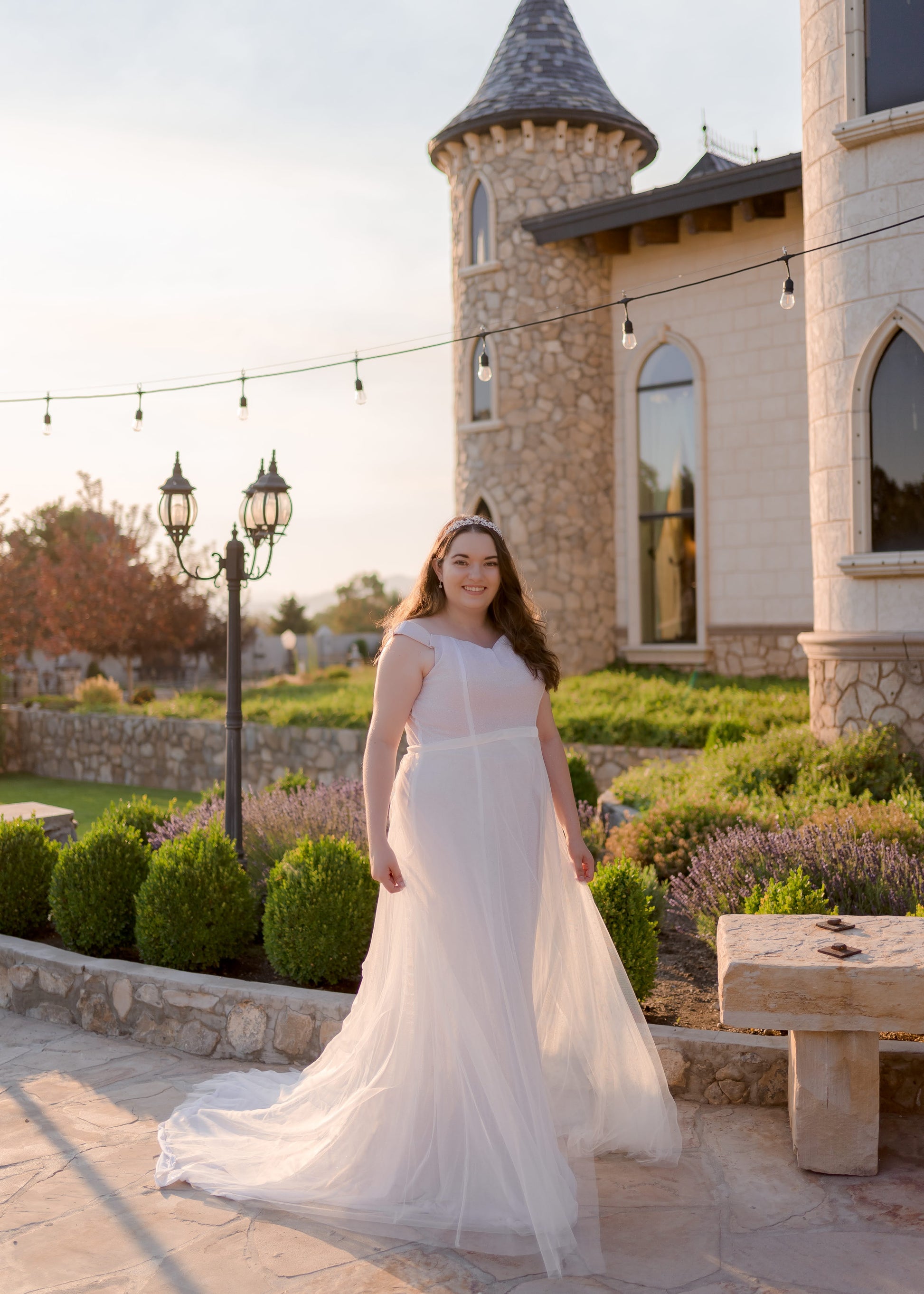 Bride wearing Alora dress with Deon soft tulle removable skirt for added volume and train.