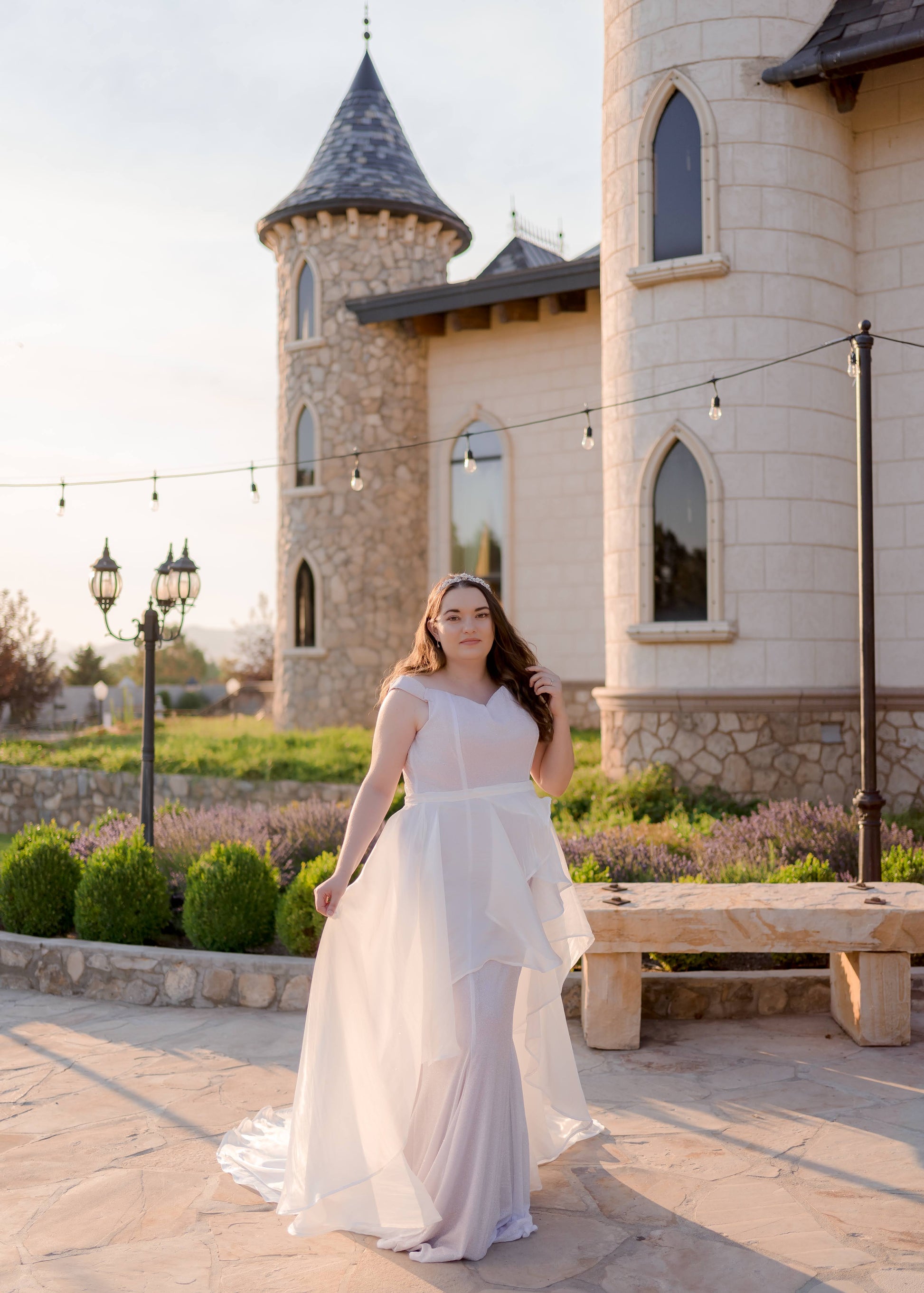 Styled image of bride in Amber skirt and Alora gown, posing in natural light to showcase the skirt’s volume and texture