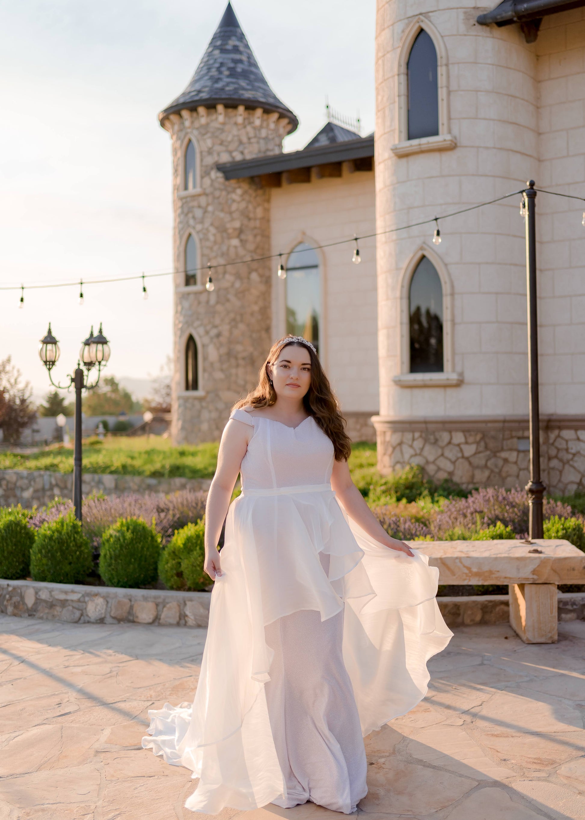 Bride walking with Amber skirt floating around her, showcasing movement and transparency of the organza overlay