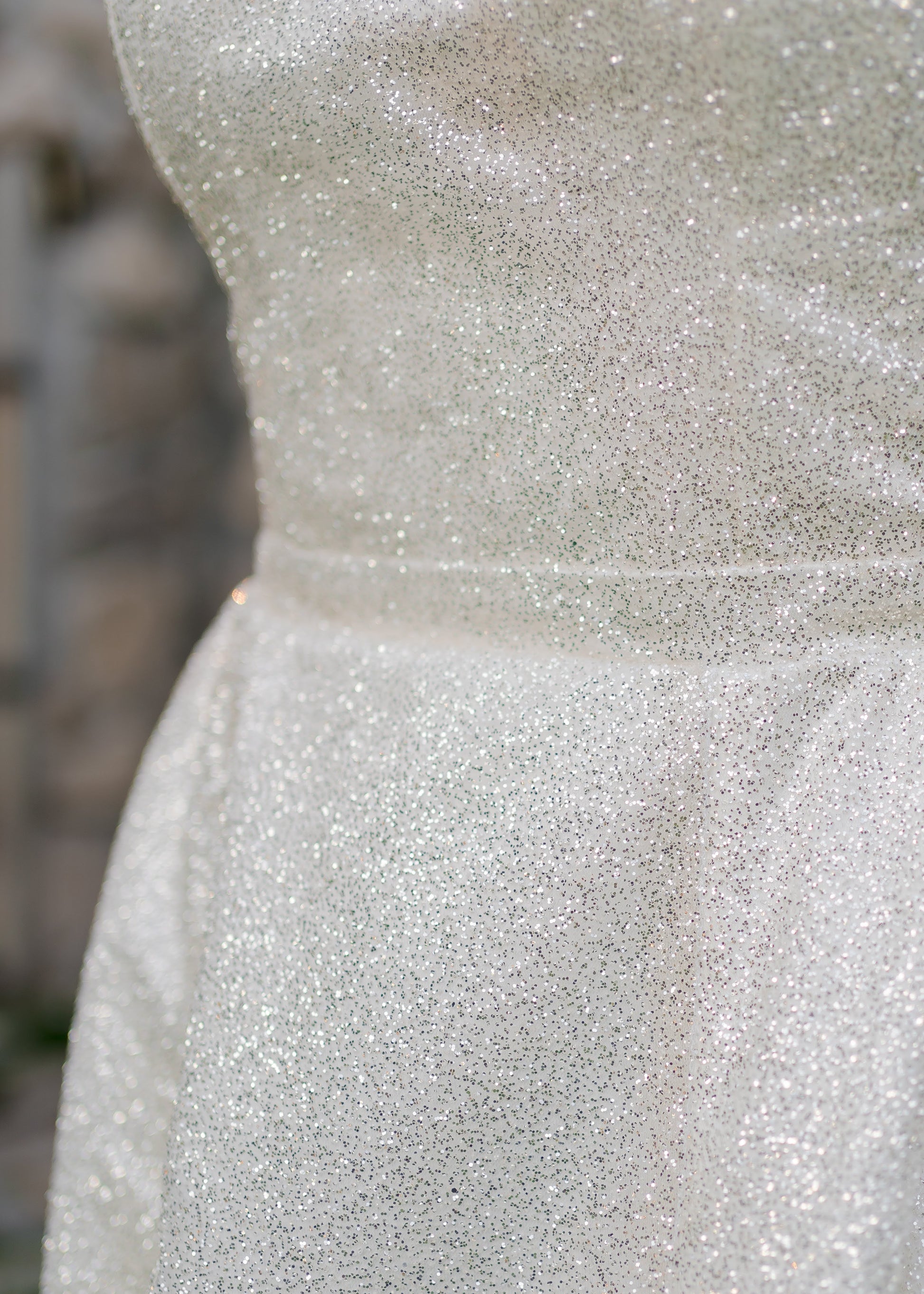 Detail shot of glitter tulle catching the light with a sparkling finish