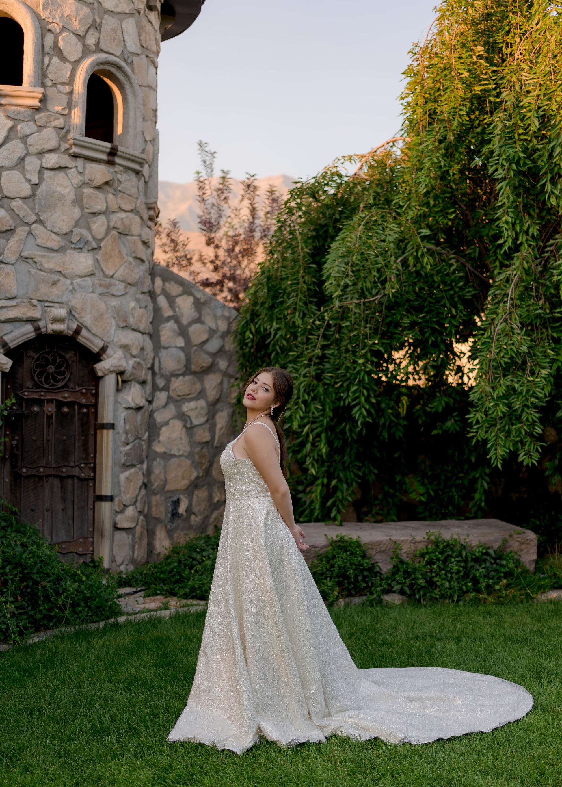 Side profile highlighting the fitted waistband and flowing glitter skirt.