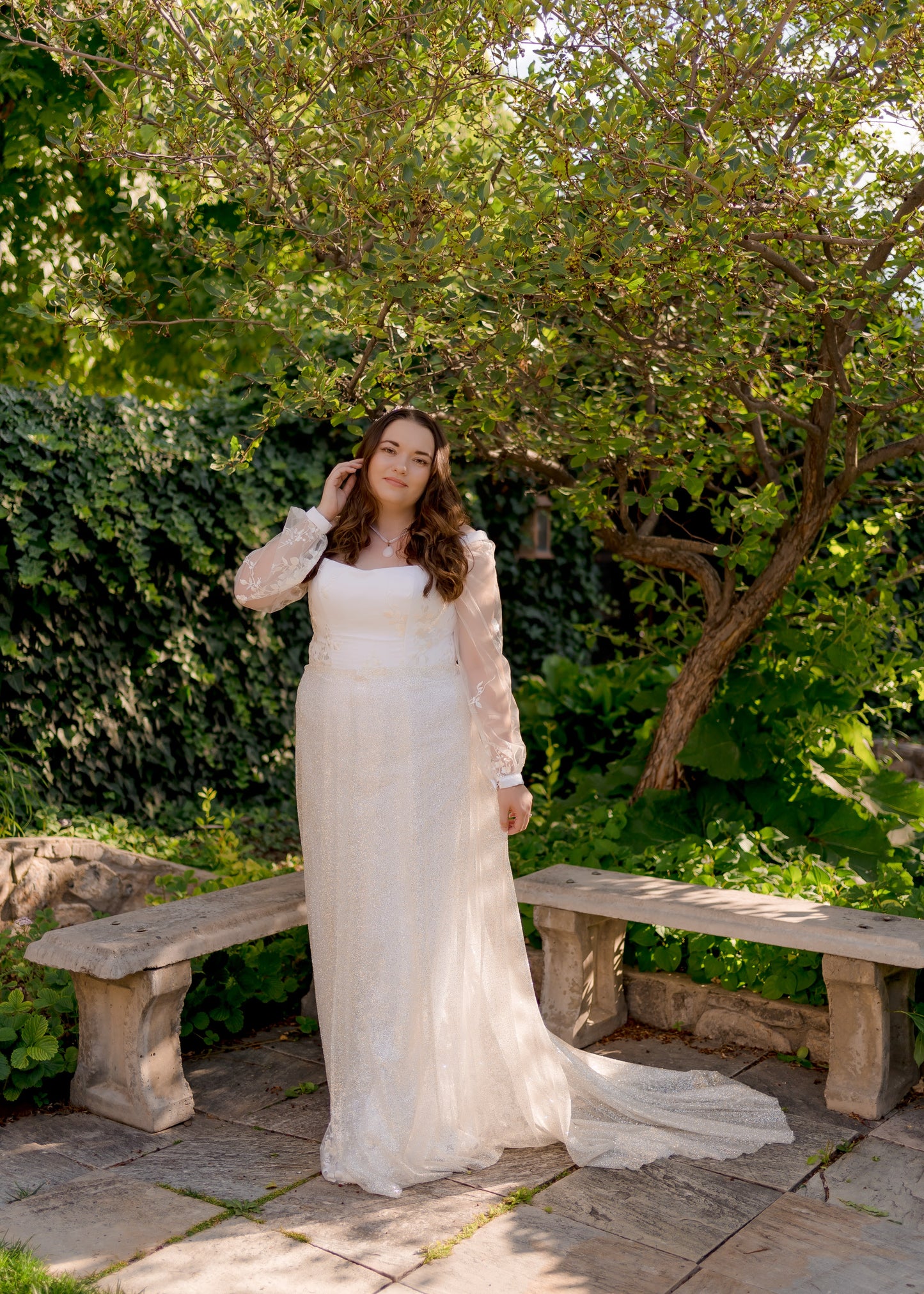 A bride wearing the calliope glitter skirt styled over fitted wedding dress, Violet.