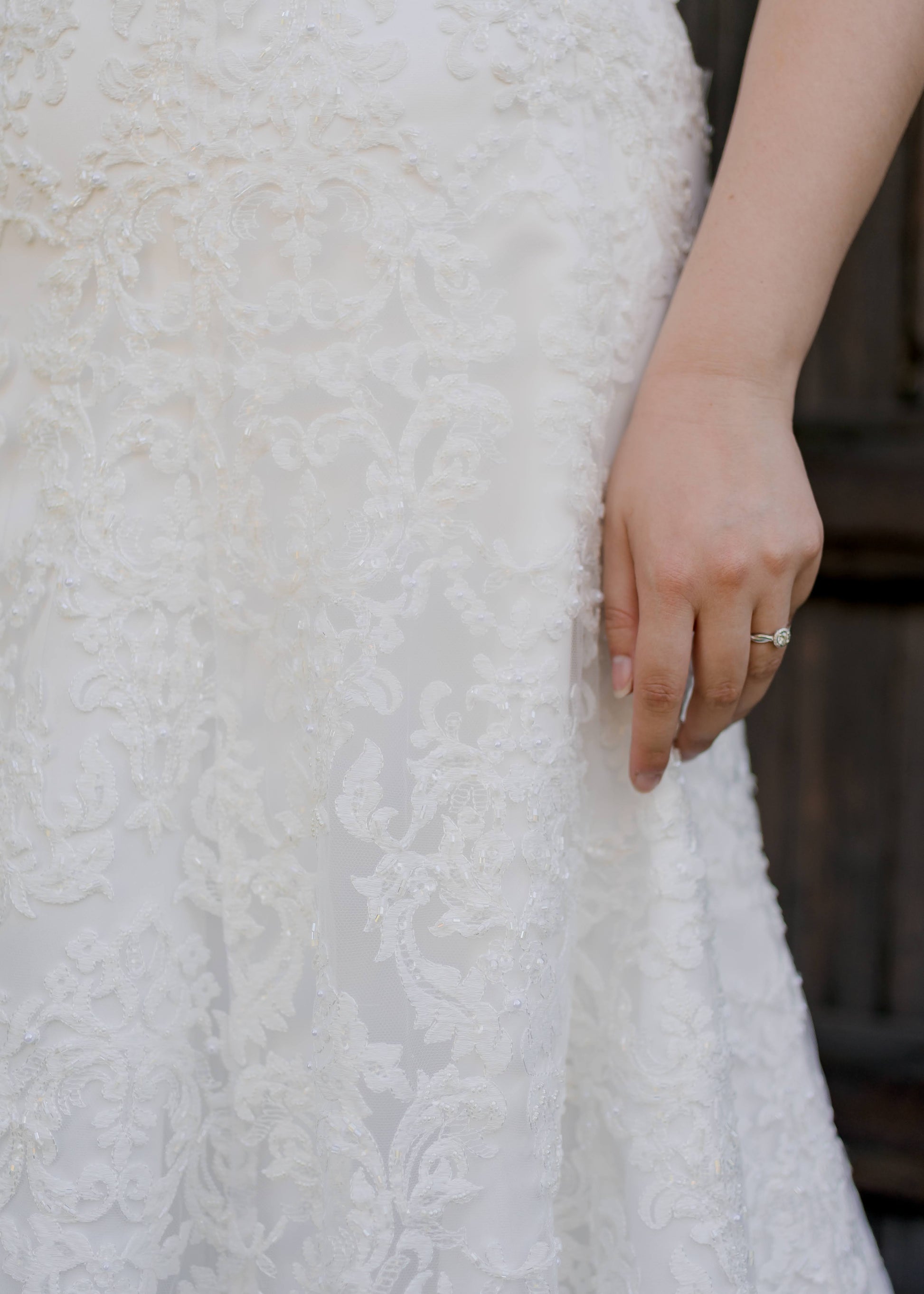 Close up of the Margaret gown in ivory with beaded lace.