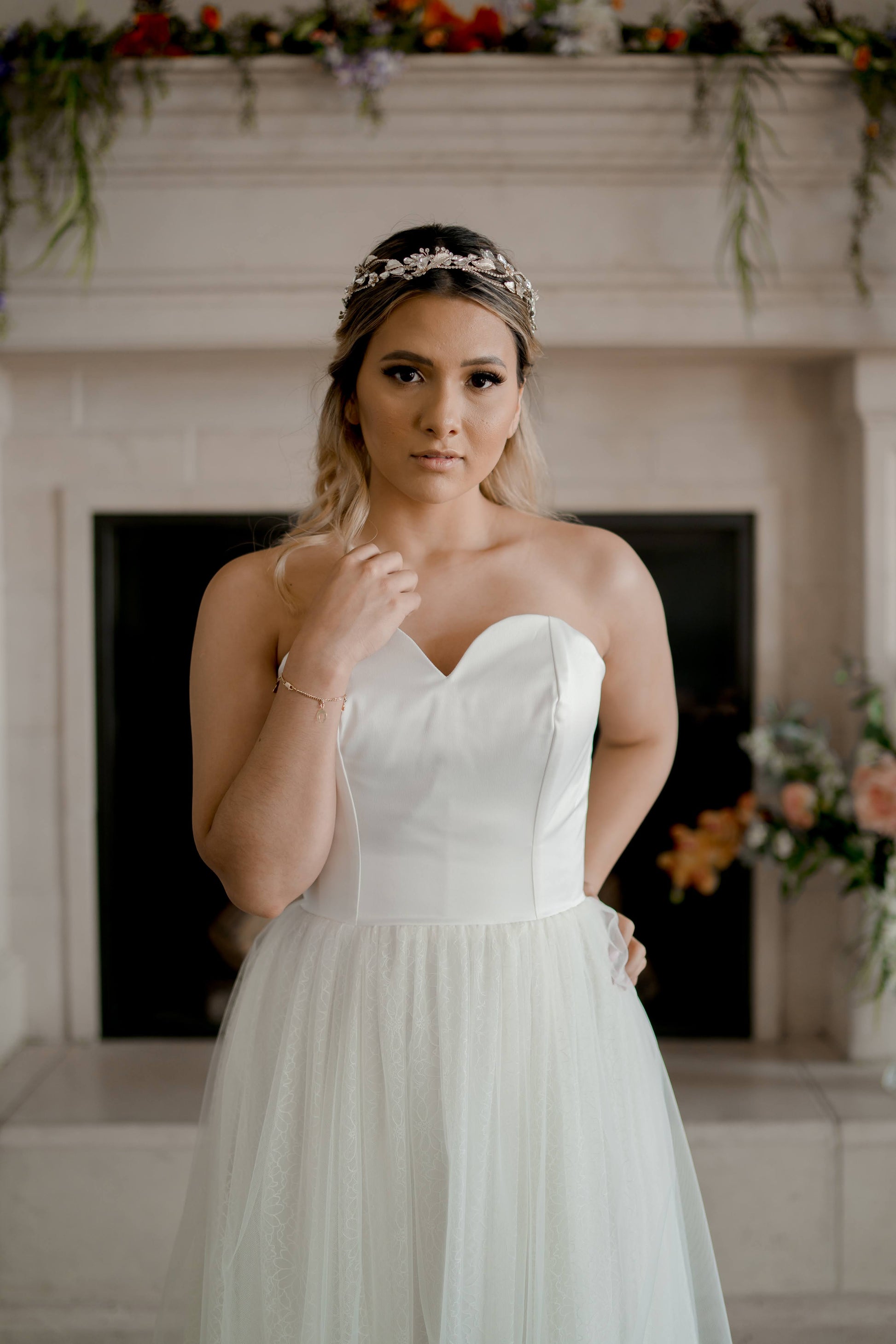 Close-up of the sweetheart bodice on the Beatrice gown, showing soft gathered tulle overlaid on top of daisy lace for a delicate textured effect.