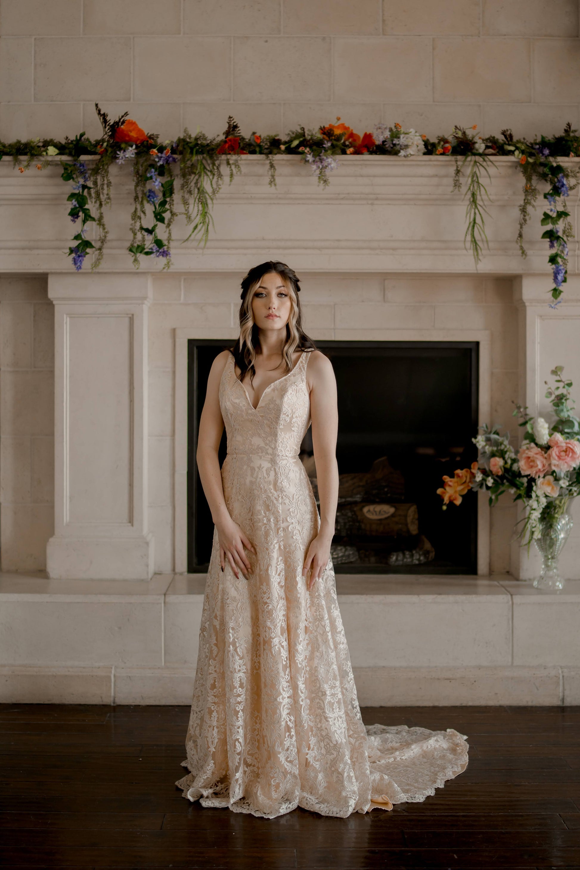The Margaret trumpet wedding gown with sweetheart-V neckline, champagne lace and satin, shown on a size 6 model.