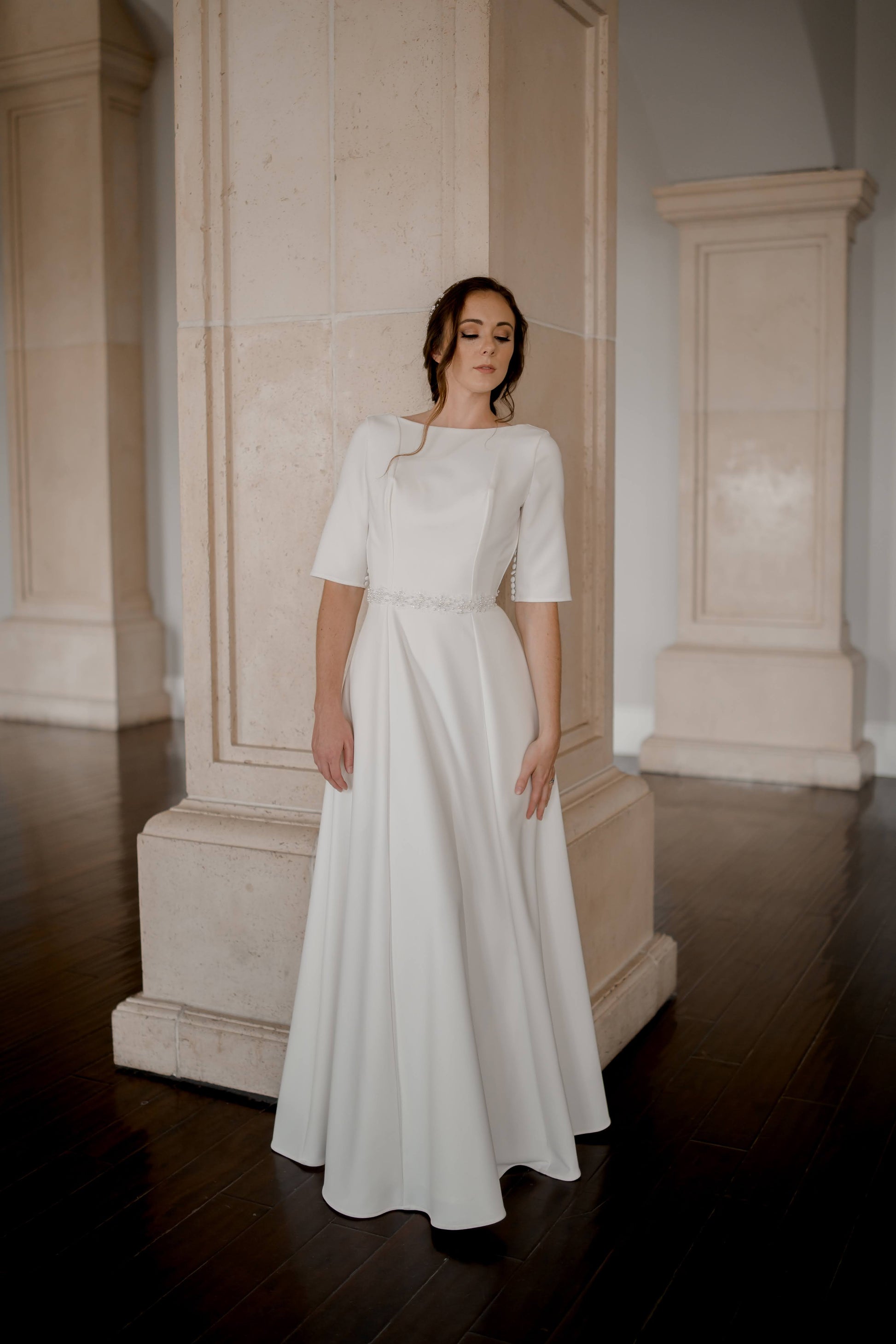 A full length image of the wendy dress from the front; it has been paired with the  Millie belt for added sparkle and detail.