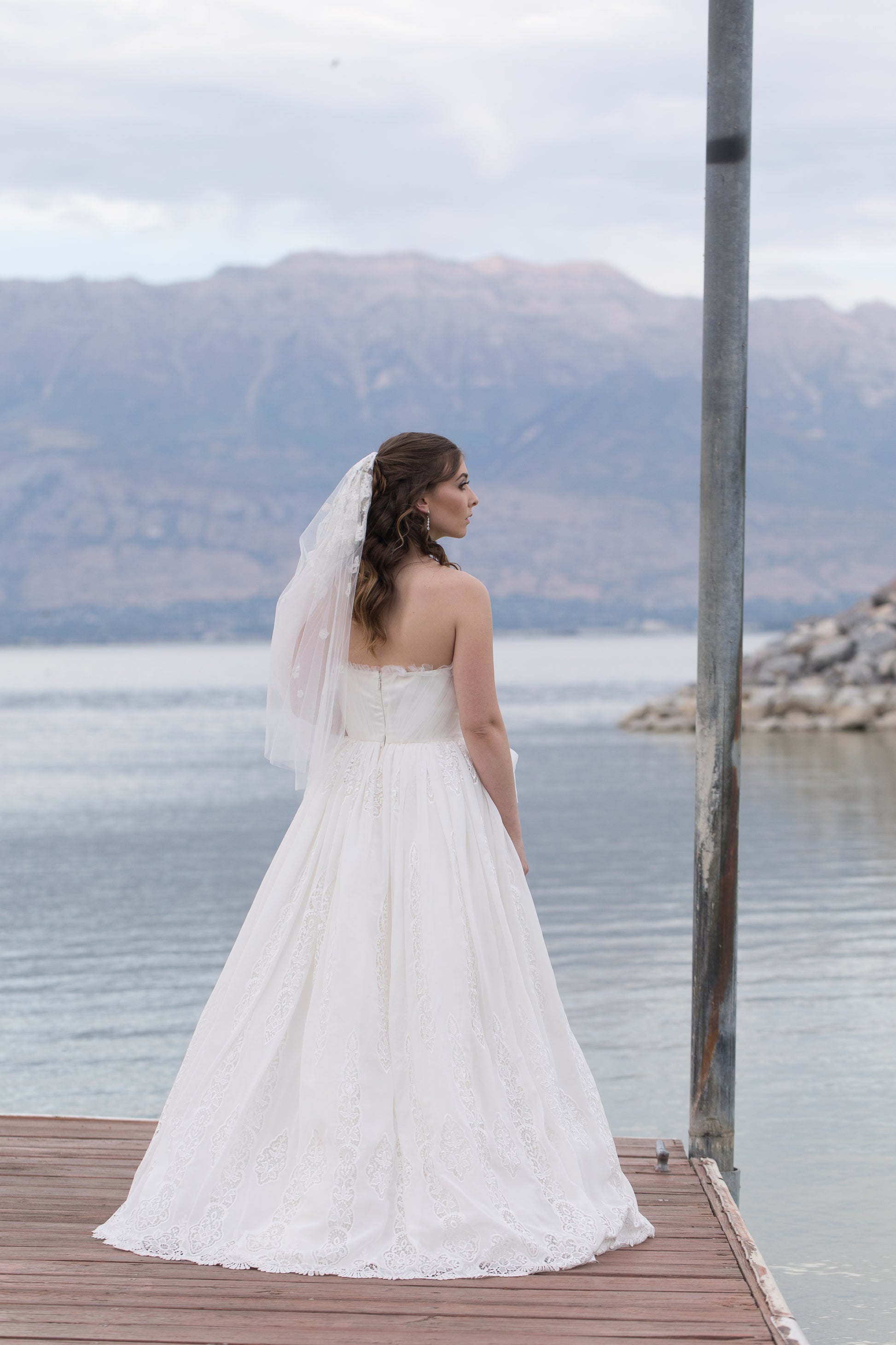 Romantic bridal portrait featuring Nerissa’s gathered bodice and floral skirt details