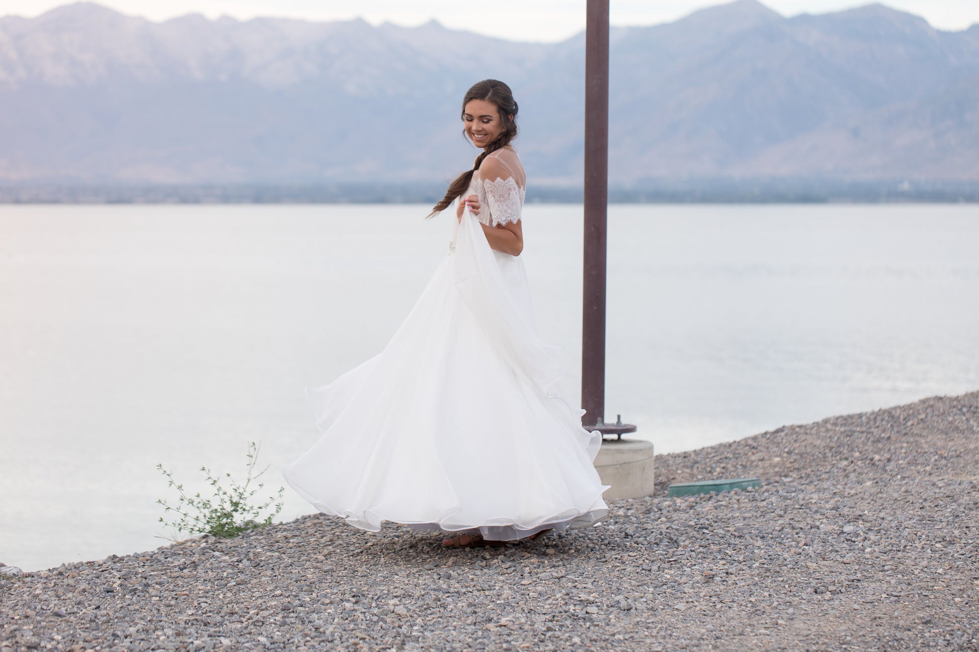 The ronelle wedding gown is shown here on a model, as she dances  in the ronelle gown the Full chiffon skirt with horsehair hem creates soft ripples.