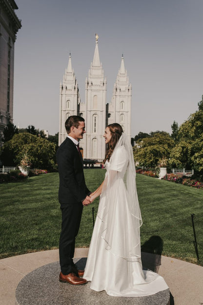 Bride wearing Ivory satin-edge calf veil – Bridget veil.
