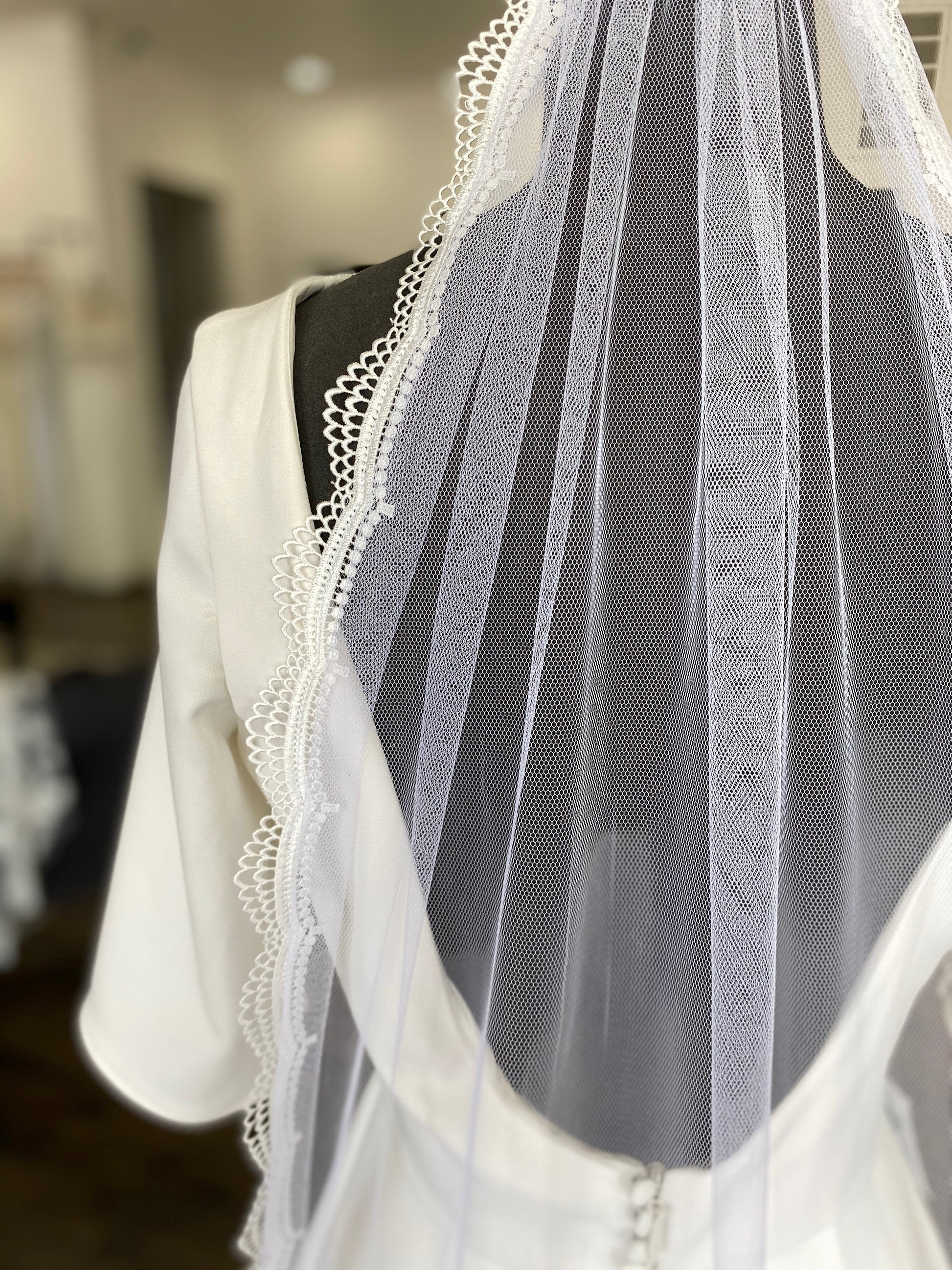 On a mannequin the Brennan veil is shown here paired with the Wendy gown for a silmple classic elegant look. 