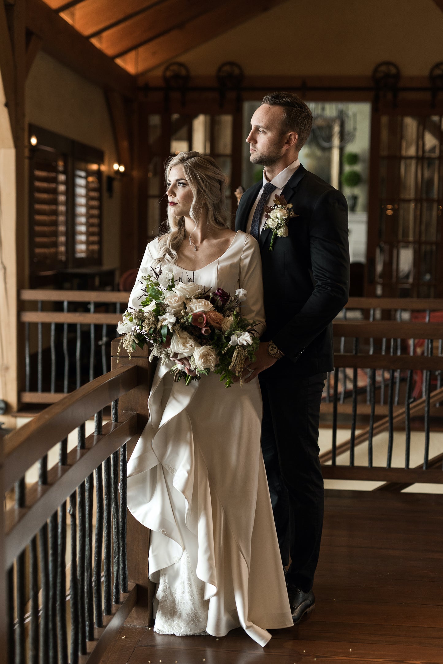 Lifestyle shot of bride with her groom, capturing natural gown flow and romantic feel.