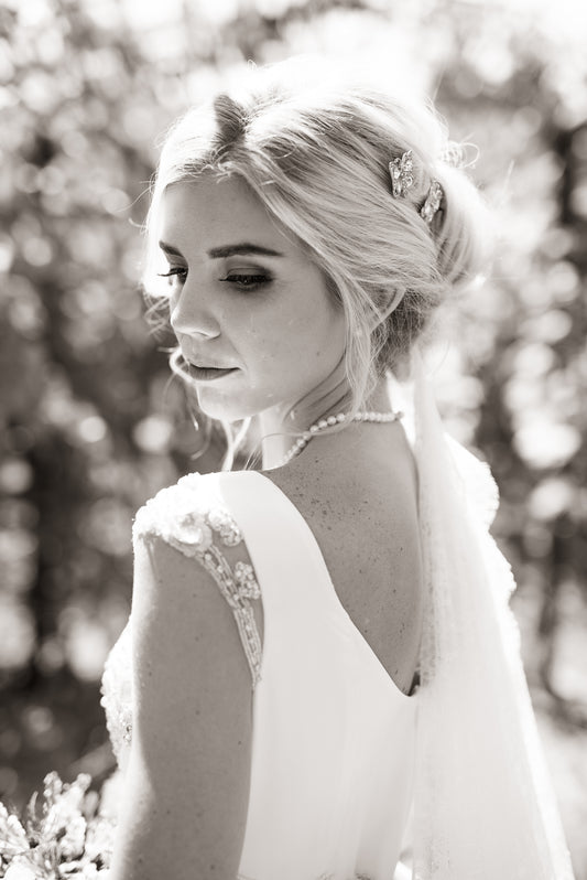 Back view of Georgias bodice with scoop back and rhinestone-detailed cap sleeves