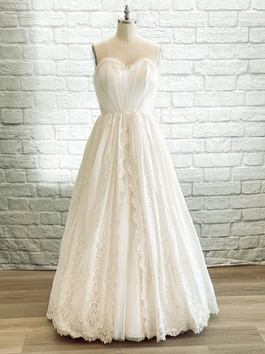 Strapless ballgown wedding dress with gathered tulle and embroidered chiffon overlay
