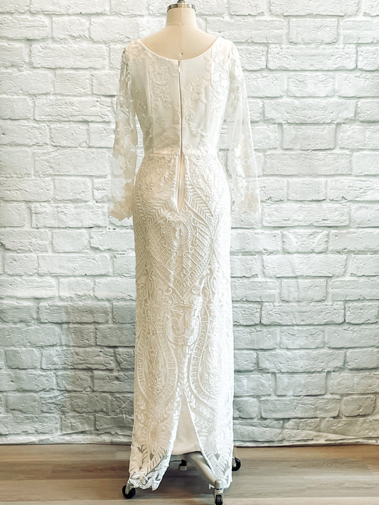 Back view of Octavia wedding dress showcasing high scoop neckline and floral lace detail