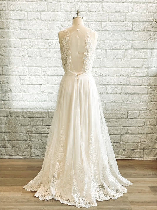 Full back Marie bridal gown with a Keyhole back with lace overlay and scalloped hem.