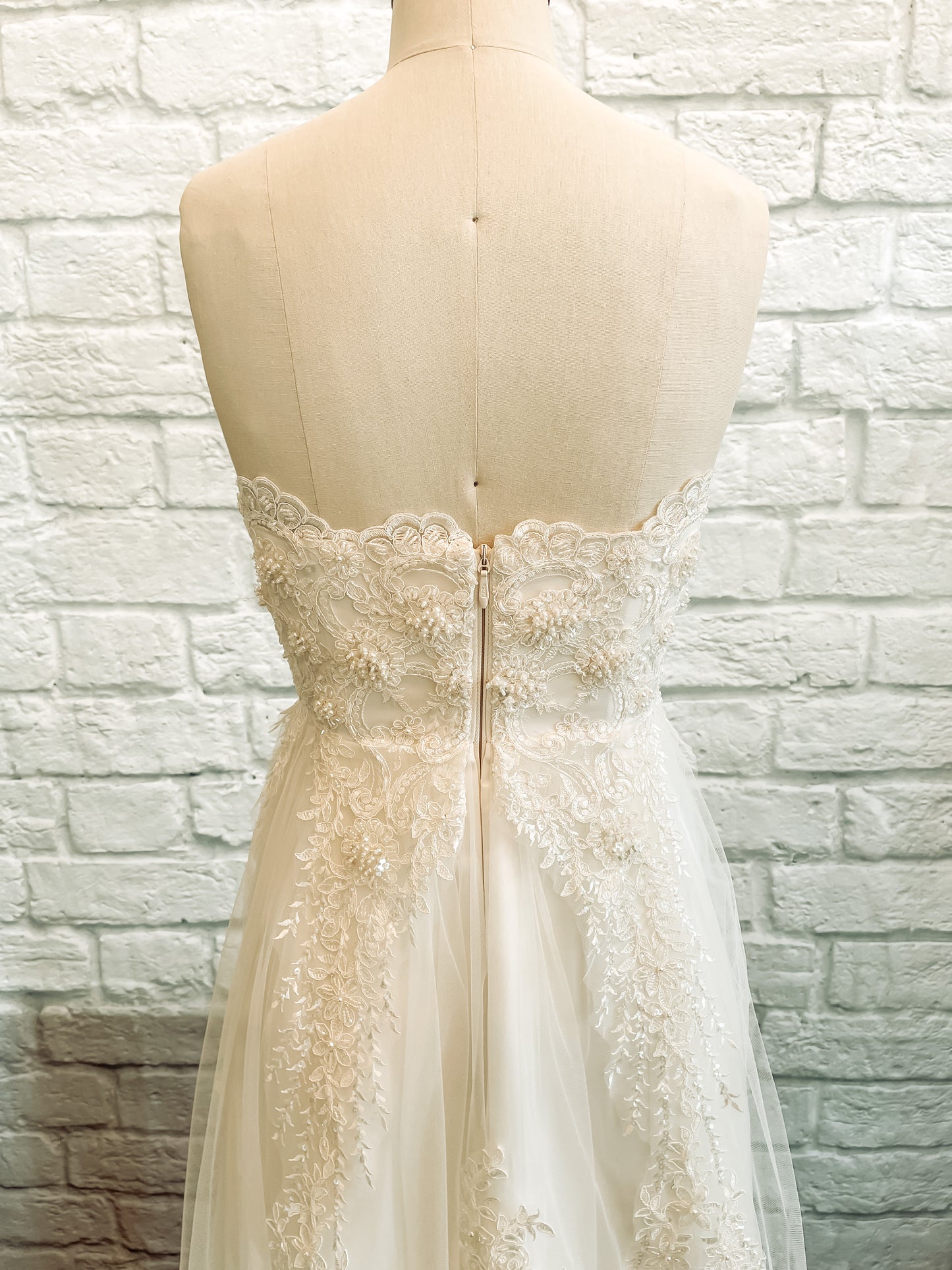 back bodice view of the kennsington gown, High-back satin bodice with structured fit and casacading lace. 