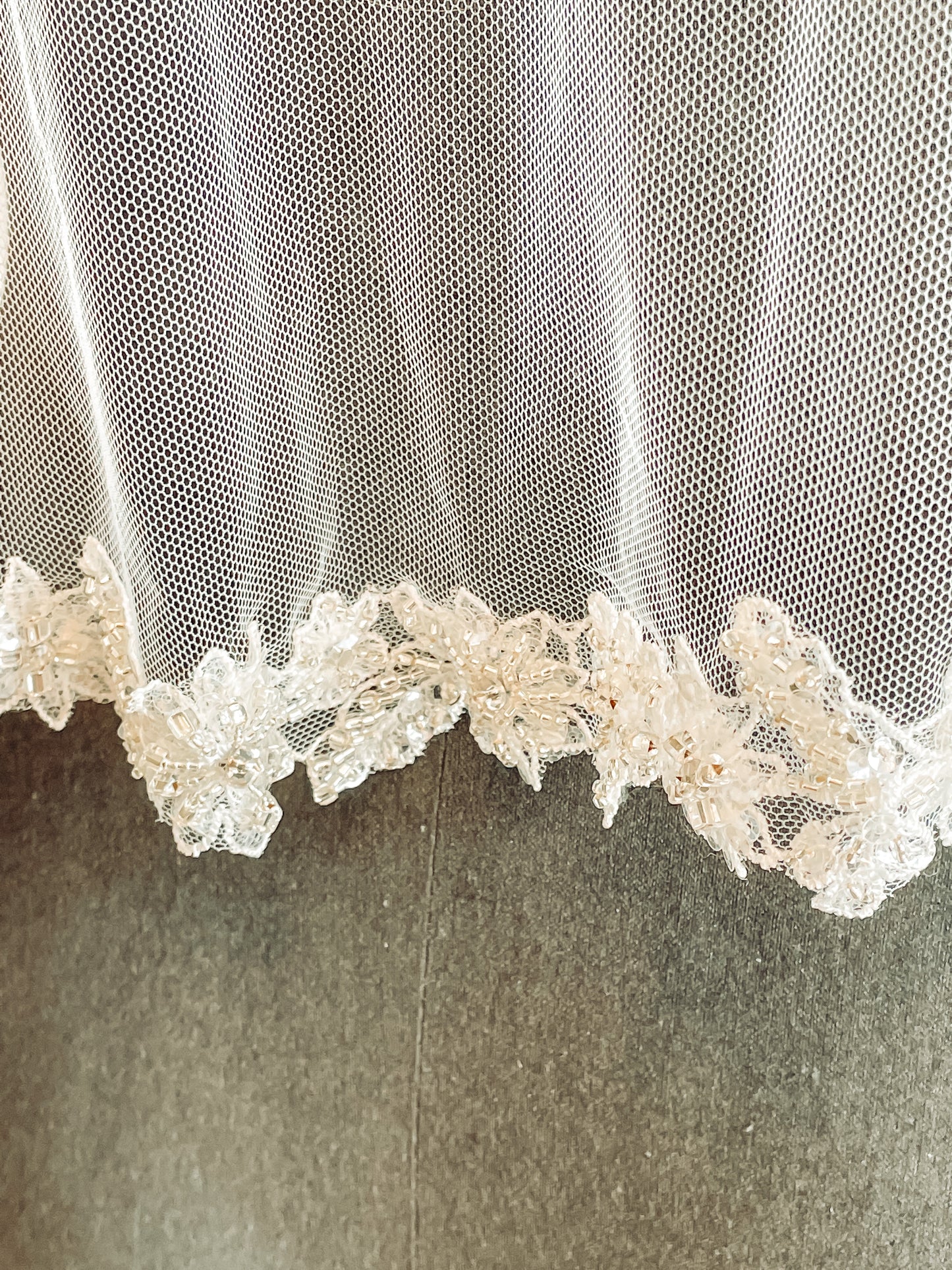 Close-up of glittering lace trim on Haven veil. 