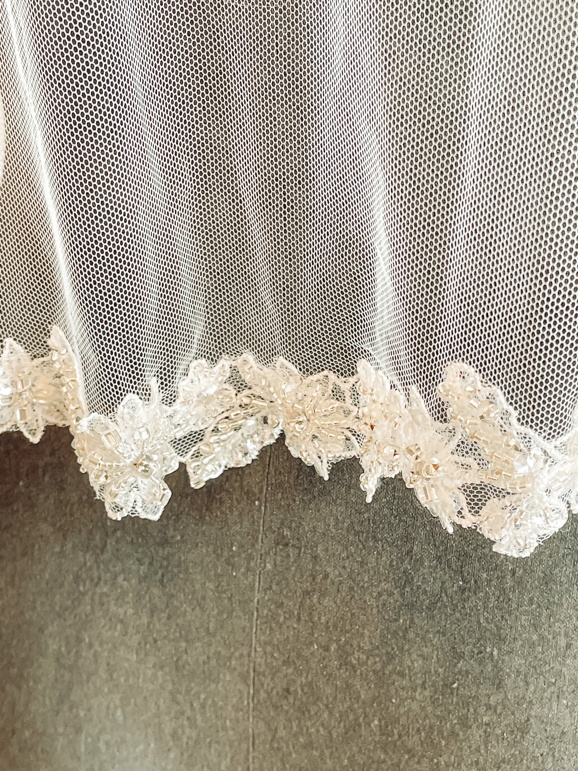 Close-up of glittering lace trim on Haven veil. 