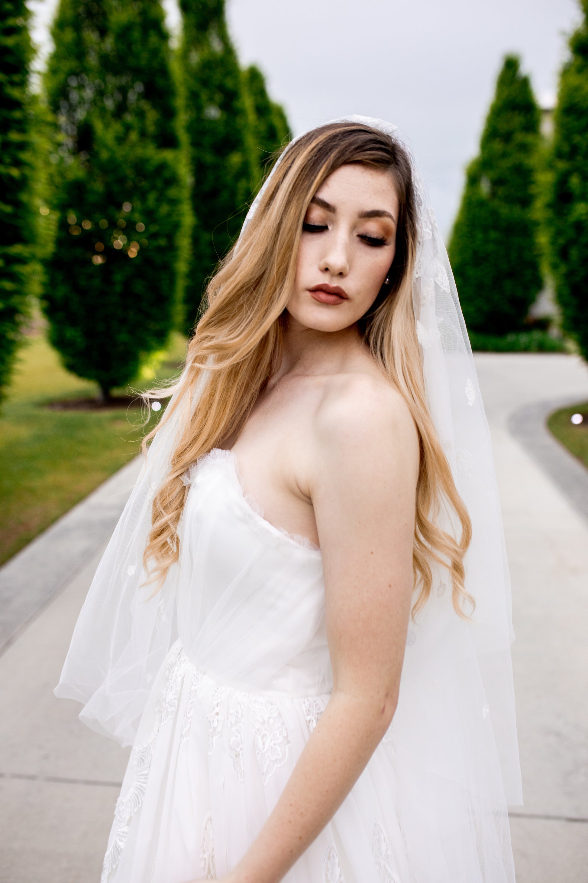 Strapless wedding dress with hand-sewn ruffle tulle and internal boning for support