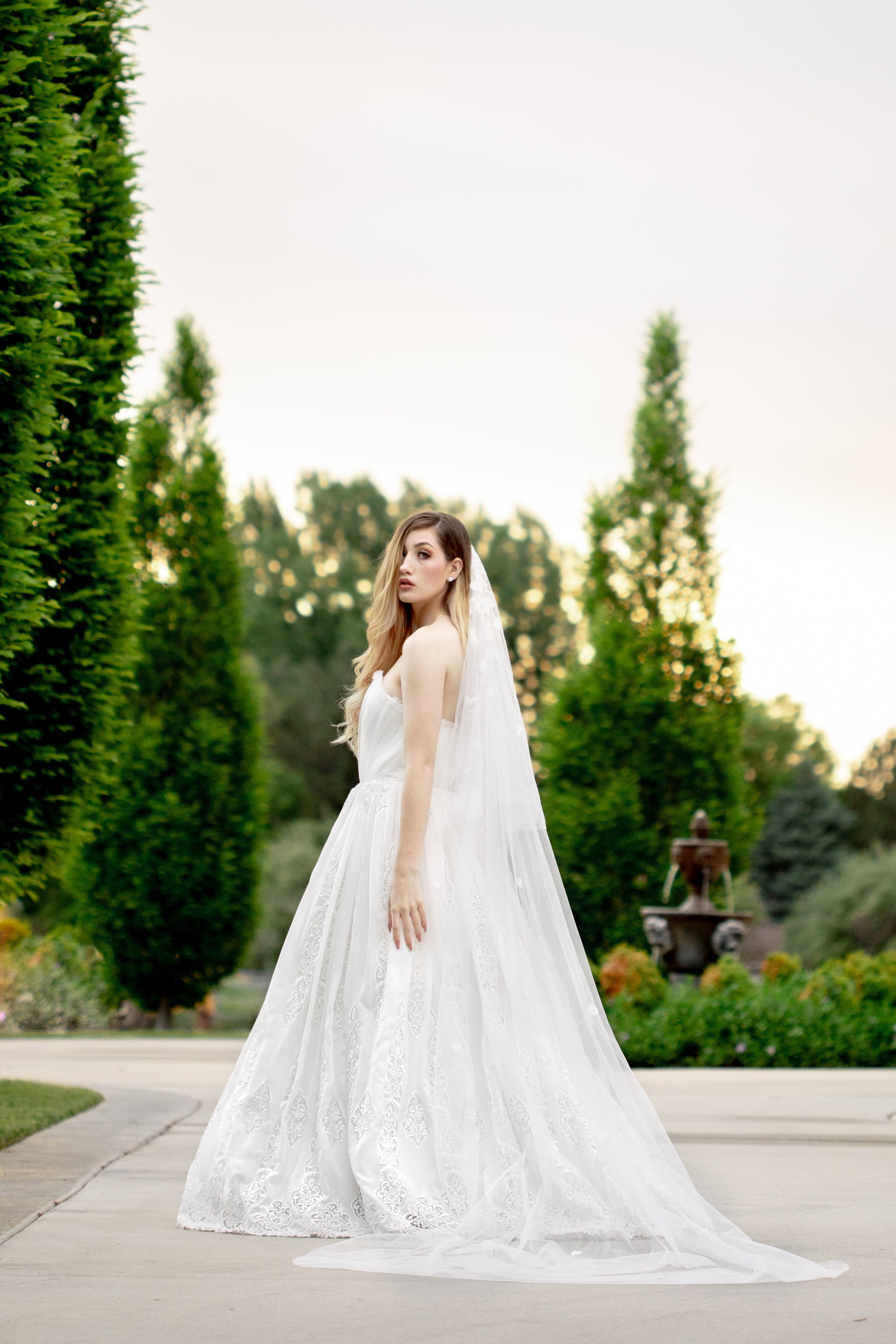 Princess-style wedding dress with layered tulle and floral embroidery details