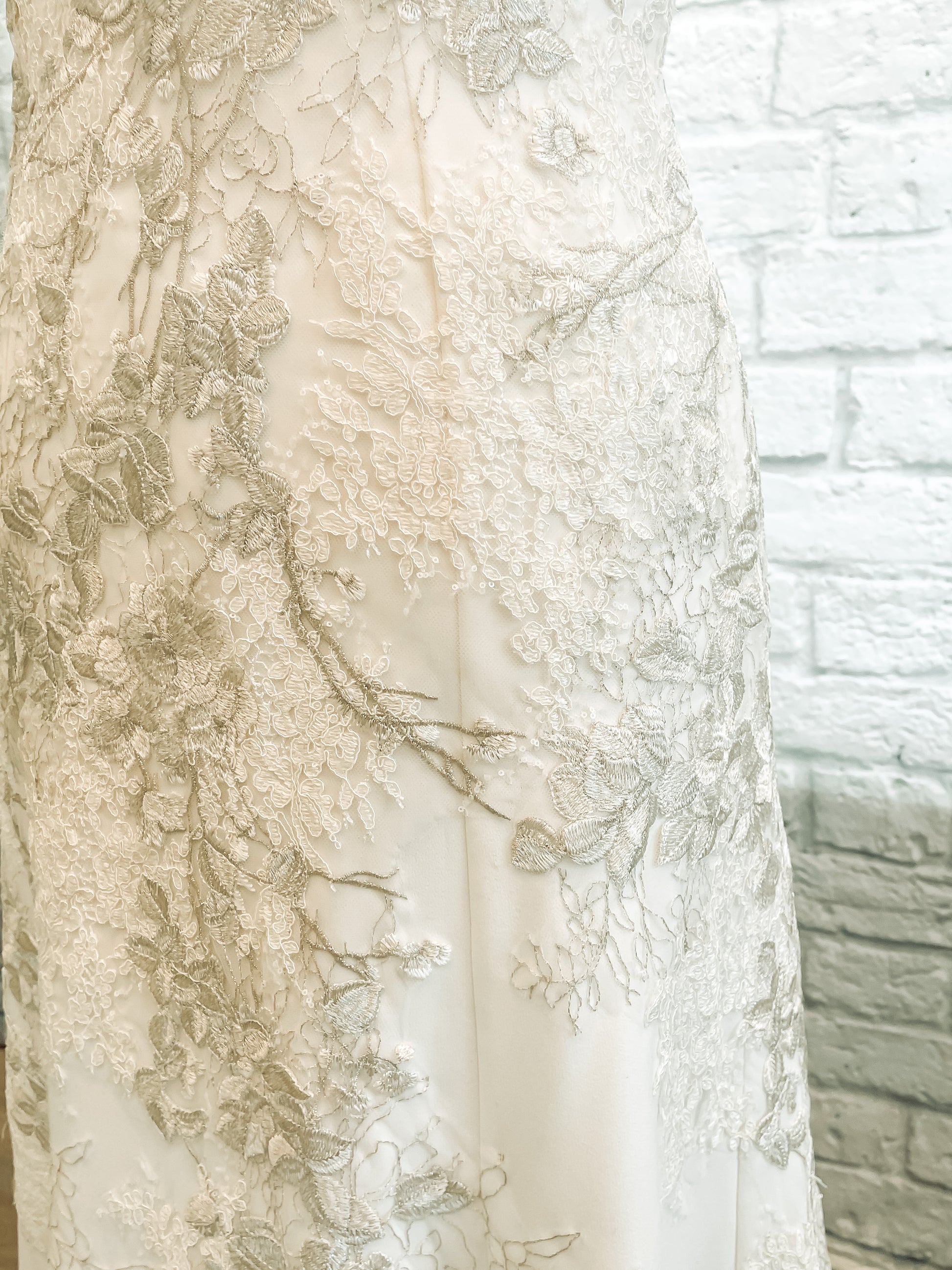 Up close lace detail showing off the cording and metallic threads.