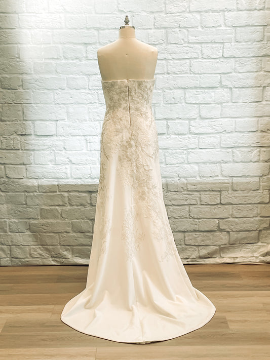 Back of gown showing smooth crepe flare and 18-inch train.