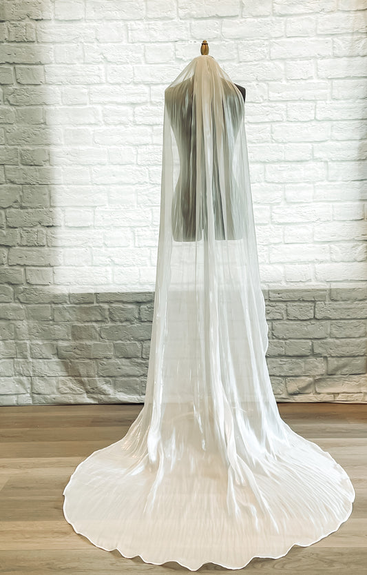 A full length photo of the cara veil, Nontraditional organza wedding veil with soft sheen, in a chapel length.