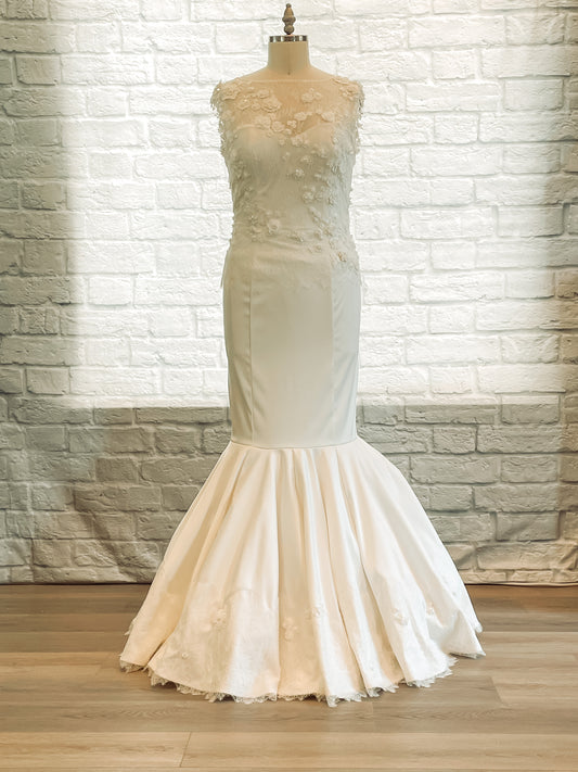 The naomi, in satin, on a mannequin, showing the wedding gown with sweetheart neckline, mermaid silhouette, and 3D lace overlay.
