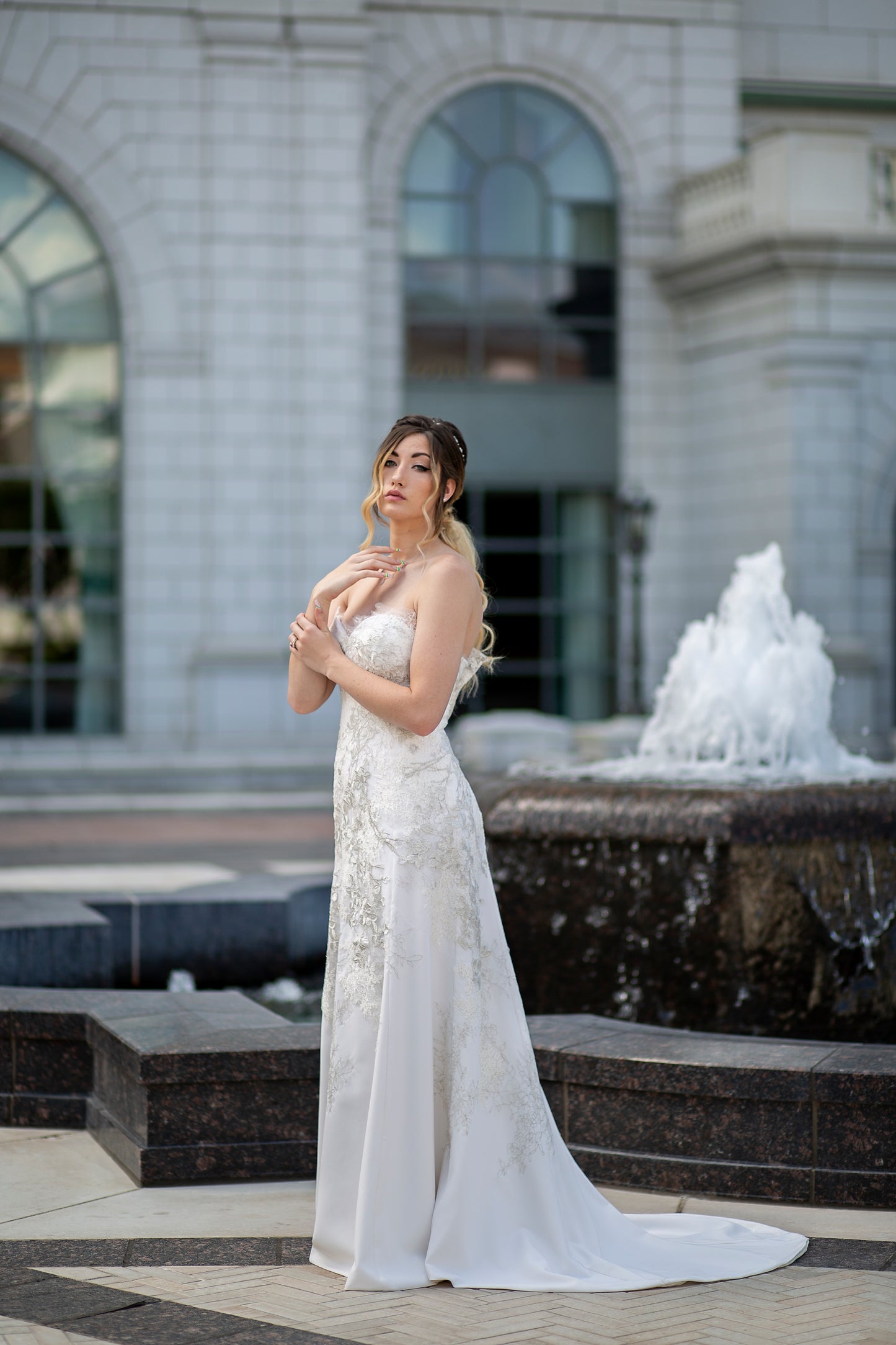 Side profile showing curve-hugging bodice and gradient lace detail. 