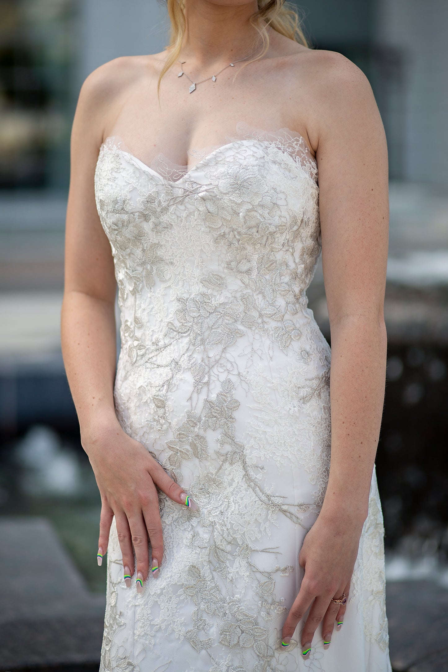 Gown with natural lace edge neckline as seen on brunette model.