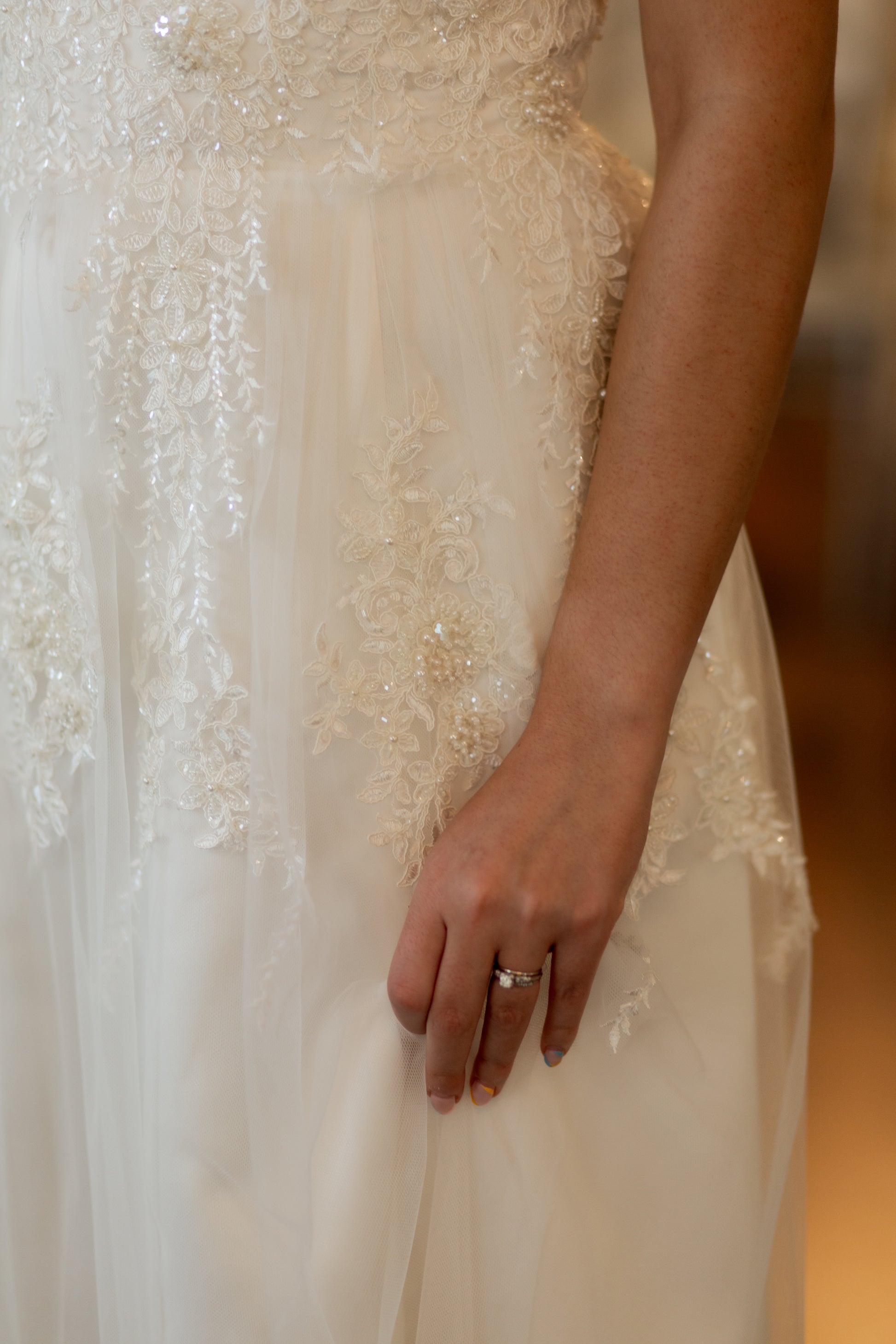 A close up of the tulle skirt with beaded lace overlay and satin skirt base. 