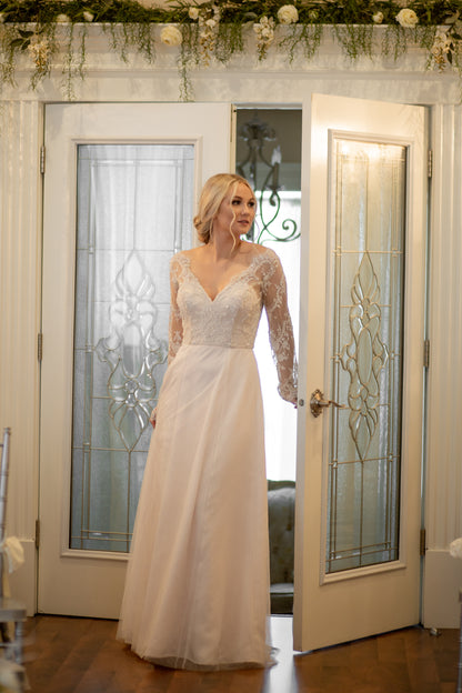 Full Front Walking motion shot, skirt moving gently to show layers of soft tullé and airy silhouette.