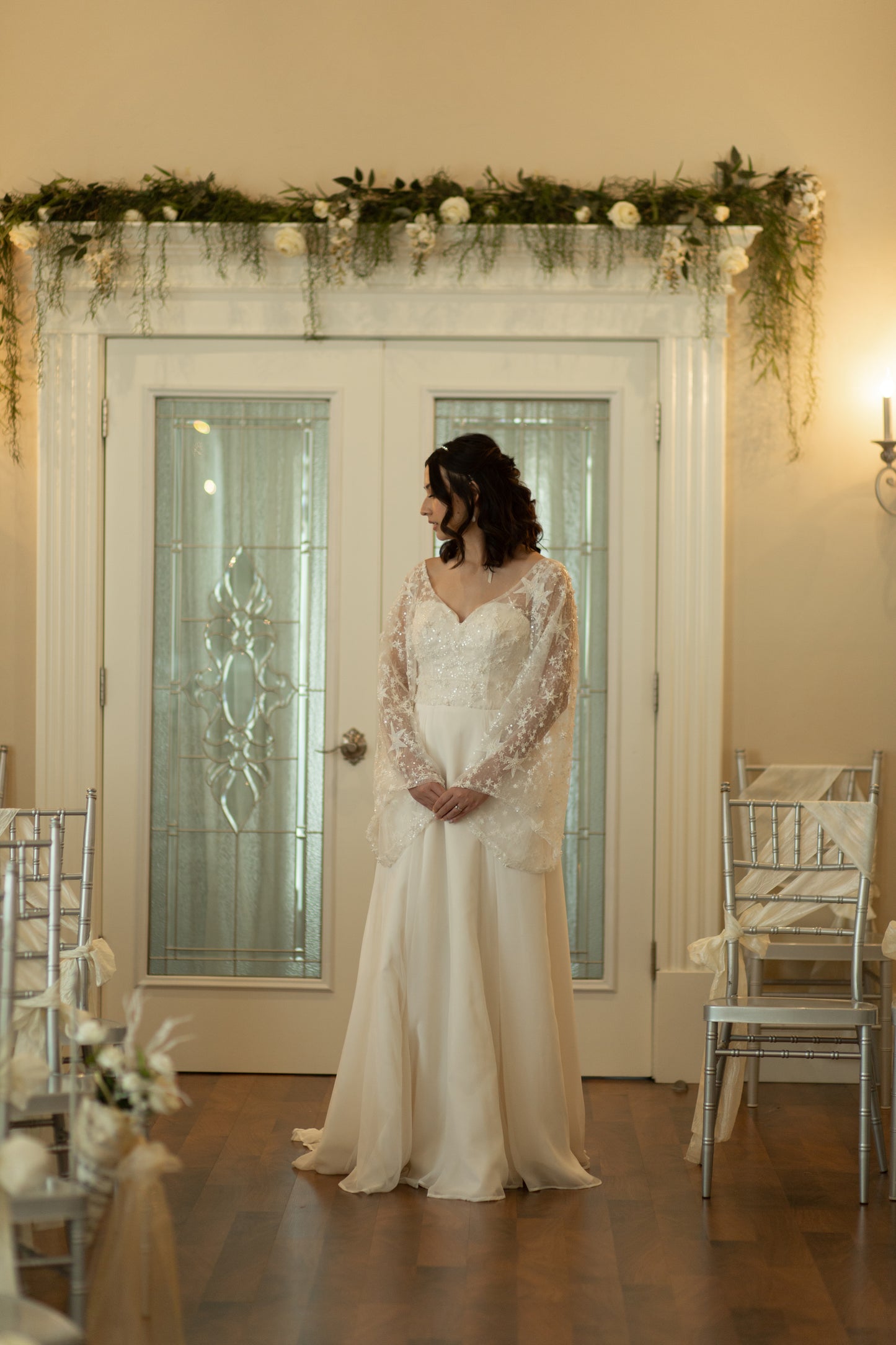 Front view of bride in Novelli gown with sweetheart neckline and star lace overlay