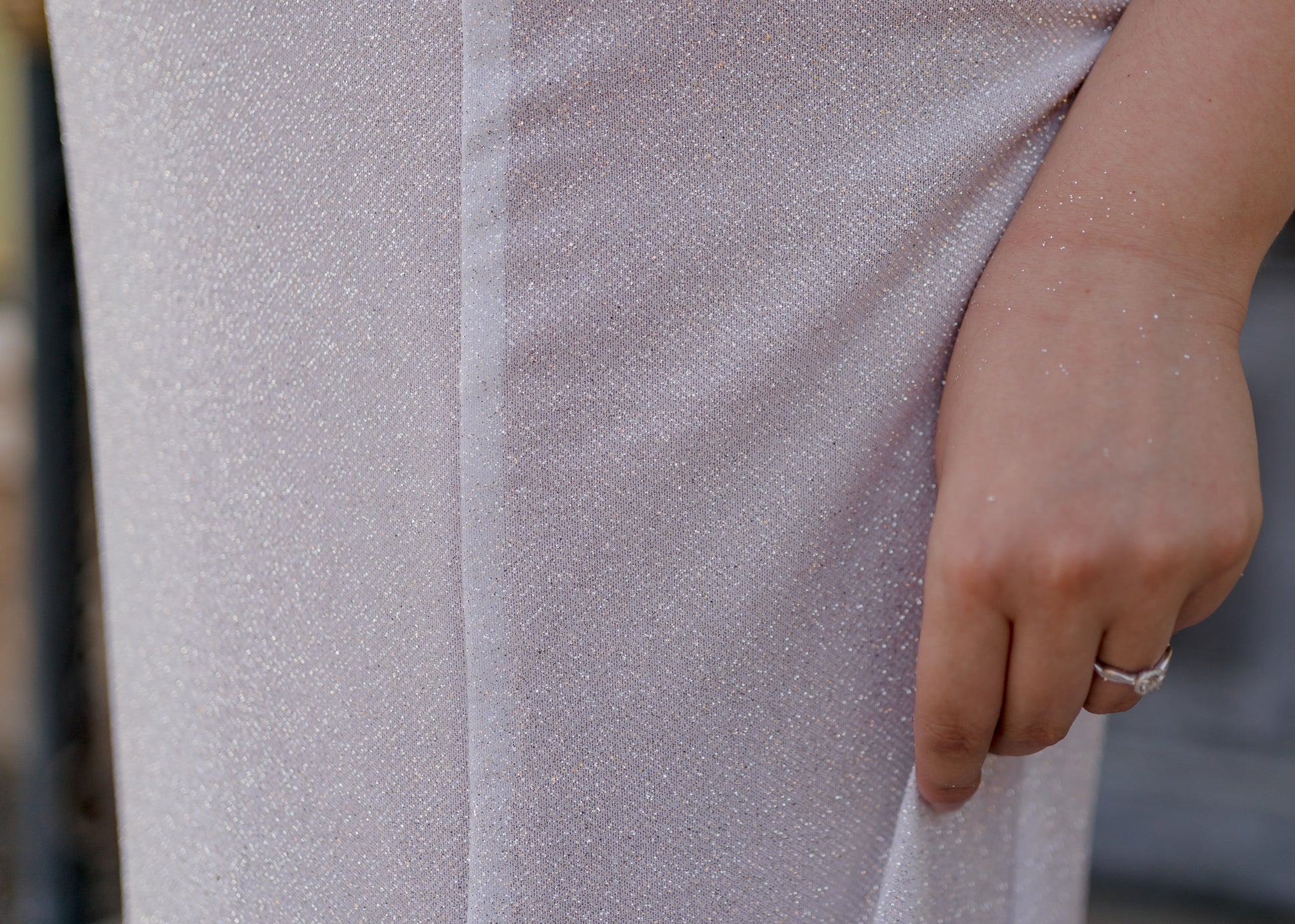 Close-up of glitter tulle fabric on Alora gown showing sparkle detail