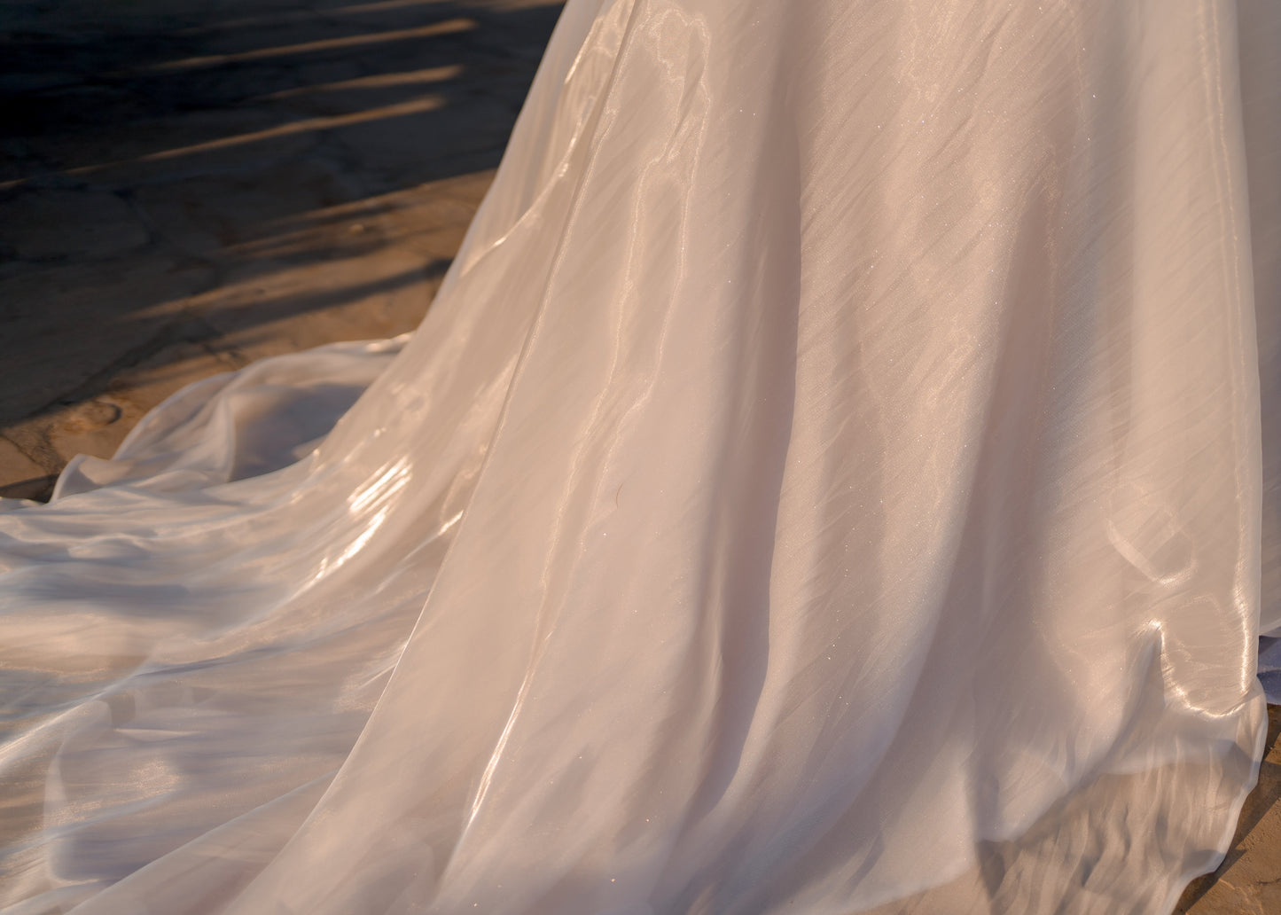 This is the back of our amber skirt, it is made out of the same fabric as our Cara bridal veil, this image is showing off the stunning water like sheen and light reflecting quality it has. 
