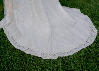 Mini scalloped beaded trim detail of the hem and train of the Parker bridal gown. 