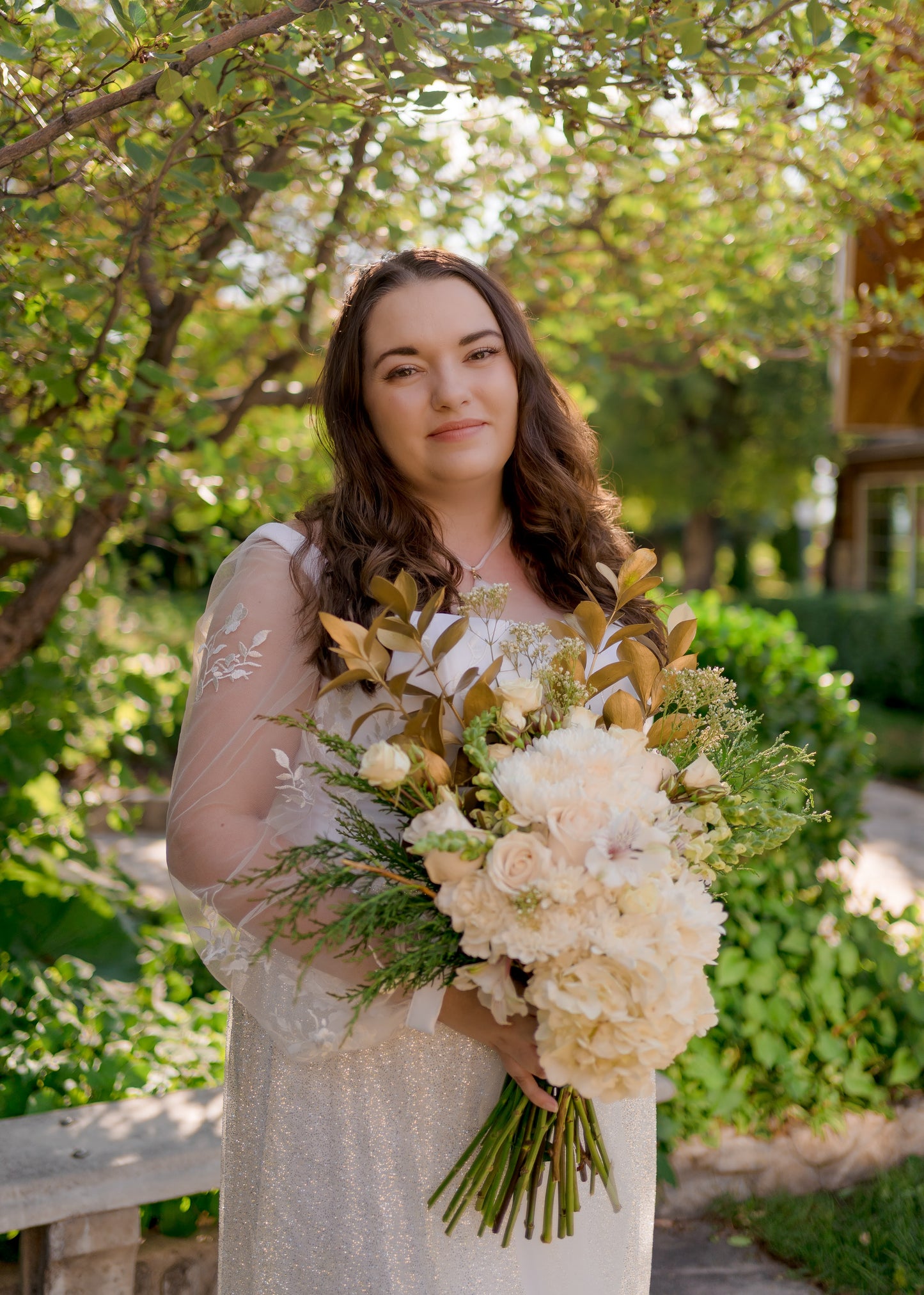 An uncle shot of a brides head and torso; she wears the violet bridal gown underneath the glitter tulle skirt, Calliope.